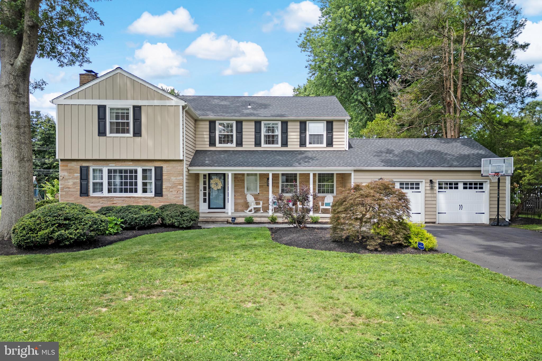 Set in the charming and very sought after neighborhood of Old Wynnewood in Yardley, this home is set amidst custom homes and beautiful trees in the desirable Pennsbury School District. This warm and inviting home offers the perfect blend of modern conveniences and classic charm. With recently updated siding and a roof, there is so much this home has to offer!
Gorgeous landscaping and a beautiful covered porch entry welcome you to the home and open to a large slate floored foyer. The foyer is flanked by a versatile den ideal for a home office, playroom or quiet retreat.
The main level with hardwood floors throughout flows beautifully beginning with a spacious living room with a wood burning fireplace. A large formal dining room, with original corner cabinets sets the stage for memorable family gatherings. French doors lead to the well-appointed kitchen featuring Energy Star stainless steel appliances, stone countertops, counter seating for gathering, and a lovely eating area for family meals with a built-in bench for storage. A large sun-filled family room features a gas burning fireplace and walls of windows. A separate laundry room and powder room complete the first floor.
Downstairs a professionally finished basement provides a large game room, custom-built bar, Pergo travertine floor, a space for a full gym and plenty of storage.
Upstairs a grand hallway connects four generously sized bedrooms including a serene primary suite with a remodeled spa-like bathroom with heated floors and a custom walk-in closet with built-in drawers and shelving. The hallway offers access to the large attic storage area.
Step outside to your totally private and lush backyard oasis, complete with a resort style in-ground salt water pool and hot tub, expansive brand new trex deck, and brick patio. A fenced yard ensures security and pool safety. The backyard also includes a large shed for additional storage. The attached two car garage with inside entry includes additional attic storage.
Perfectly located near shopping, Route 1, PA turnpike, I-95 and I-295 as well as convenient rail stations for easy commute to New York, Princeton and Philadelphia. 21 Milton Drive is more than a house, it's an opportunity to live in the home of your dreams!