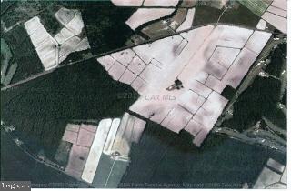 285.19 acre parcel adjoins to the Bay Club Golf Course just outside of Berlin City limits. Abundant road frontage. Existing farm house is of no value and has been unoccupied for many years. It is unsafe to enter.