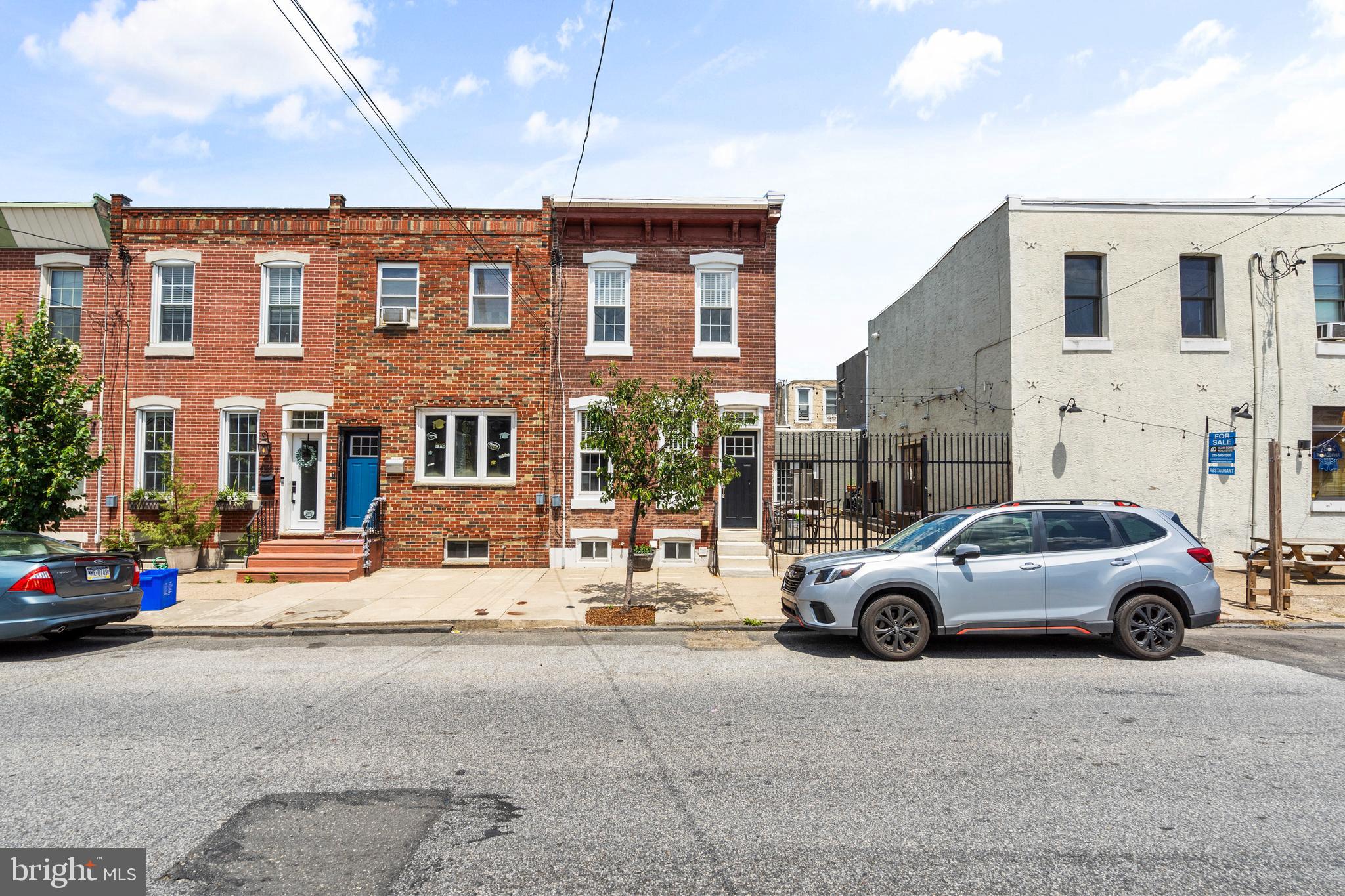 Welcome to this stunning brick-front townhome in the heart of Port Richmond! This three-bedroom, two-and-a-half-bath home perfectly blends modern updates with timeless charm. Step inside through the entry foyer and into the oversized living room filled with character. High ceilings, elegant crown molding with up-lighting, rich woodwork, and a cozy electric fireplace create a warm and inviting space. Storage is plentiful, and a convenient powder room completes the main level. The open-concept layout leads seamlessly into a gorgeous kitchen featuring soft-close cabinetry, granite countertops, tile flooring, and stainless steel appliances. Just beyond the dining area you will find a private backyard, complete with a spacious concrete patio—ideal for entertaining or enjoying a quiet moment outdoors. Upstairs, the intimate primary bedroom features exposed brick and its own electric fireplace, offering a cozy retreat. Down the hall, two additional bedrooms and a beautifully updated three-piece bath provide comfort and style. The partially finished basement has potential for even more living space, complete with a second full bathroom, a laundry area, and ample storage. With updated flooring, windows, electrical, HVAC, and mechanicals, this home is as efficient as it is stylish. Located in a prime spot, you're just steps from Port Richmond’s top dining, cafés, and shops; with easy access to public transportation, major highways, and the continuously growing community. Schedule your tour today!