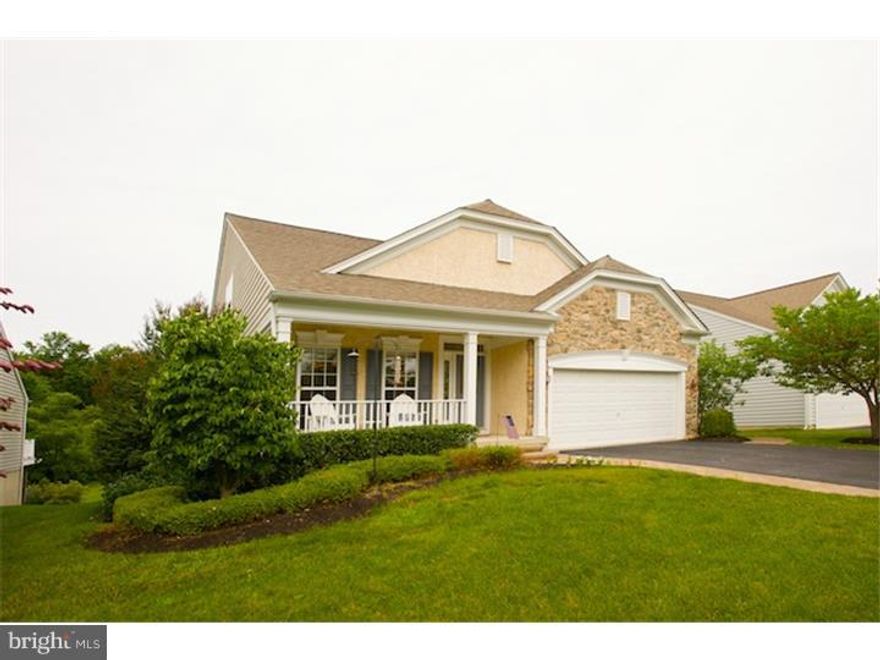 It is not being trite to say that you will not believe it when you see this home!  The sellers have upgraded it to an investment of well over $620,000!!  Situated on a beautifully private lot backing to open space, this 3 bedroom, 4 full bath home with finished lower level offers everything you could want in a 55+ community.  Mahogany floors extend through the entry hall, living room, dining room, kitchen and Florida Room.  The totally renovated Waterbury designed kitchen excels with Dacor stainless steel appliances: 5 burner gas cook top, convection and wall oven, and French door refrigerator; Villeroy and Boch farm sink; center island with drawers and cabinets; wine storage; and other features too numerous to mention.  Imagine a dining room with a gas fireplace and built in tall cabinets with cherry top for all of your occasional dishes.  The vaulted ceiling living room features a corner fireplace with marble surround for cozy winters or enjoy bright sunny days in the Florida room.  The updated master bath now has a Kohler soaking tub with tumbled travertine marble surround, and a Swanstone shower with seamless glass spa doors.  A local craftsman created the solid cherry built-in desk and cabinetry in the first floor office, which could be converted back to a bedroom.  The second floor features a loft, bedroom and full bath.  The delightful surprise is the finished lower level with amazing theater, recreation room, full bath, bedroom and workshop.  Relax and enjoy the open space from the large deck or the newly installed 3-tier paver patio surrounded by perennial gardens.  You will not want to miss your personal inspection of this exceptional property.