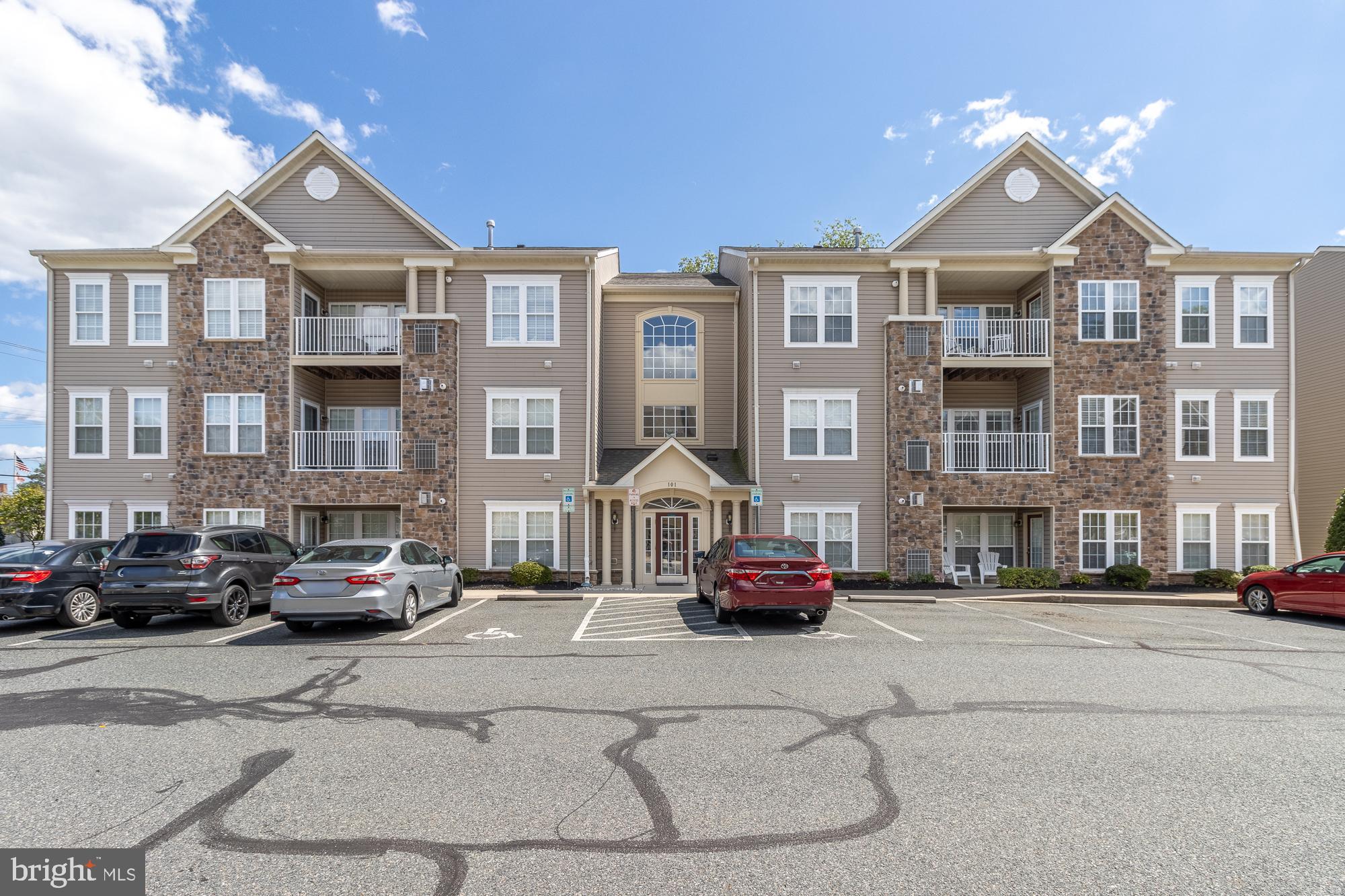 Summer may be "over," but the livin' is still easy in Bel Air's premier 55+ community! Discover a stress-free fresh start in this beautifully updated first-floor condo at the desirable Hearthstone at Village Square. Unit B offers the perfect blend of comfort, convenience, and community. Just a stone's throw to the Ma & Pa Trail and minutes from all that downtown Bel Air has to offer. Step inside to find brand new carpet and fresh paint throughout, creating a clean, move-in-ready feel. Thoughtful upgrades include modern high-efficiency LED lighting and refreshed finishes in the primary bath, plus brand new washer and dryer. The spacious open-concept living and dining area is highlighted by a cozy gas fireplace and soaring 9-foot ceilings, with large windows that fill the space with natural light. The kitchen provides plenty of cabinetry and a generous pantry, while a versatile bonus room (ideal for an office, den, or breakfast nook) opens to a private rear patio with tranquil views of mature trees. Both bedrooms feature en-suite access to full baths, including a primary suite with walk-in closet and a walk-in shower. A full in-unit laundry room (with brand new washer and dryer) and ground-level entry (no stairs or elevator needed) make this home exceptionally functional and accessible. Enjoy maintenance-free living and easy access to Bel Air's favorite shops, restaurants, coffee houses, the Farmers Market, and seasonal events. Medical facilities and major commuter routes (Rt 24, Rt 1, and I-95) are close by, offering peace of mind and convenience. This turn-key condo is ready for you to move in and make it your own. Don’t miss your opportunity to experience one of Bel Air's most welcoming 55+ communities. Schedule your private tour today!