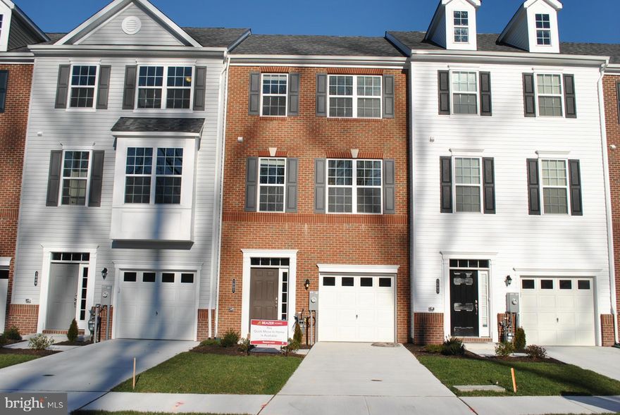 IMMEDIATE DELIVERY, 2 OWNER SUITES ON UPPER LEVEL WITH 2 FULL BATHS, 3RD BEDROOM ON LOWER LEVEL WITH FULL BATH, 1/2 BATH ON MAIN LEVEL.  FULLY LOADED! BRICK FRONT, SS APPLIANCES HW FLOORS THROUGHOUT MAIN LEVEL, UPGRADED CABINETS & COUNTERTOPS, FRONT LOAD WASHER & DRYER, SPEAKER PACKAGE, ALARM SYSTEM, HUGE DECK! UP TO $10,000 TOWARDS CLOSING COSTS. HOA FEE $56/MONTH