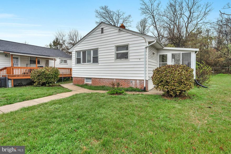 This is one of those homes that just feels right the moment you pull up. Sitting at the end of Bright Circle, a quiet cul-de-sac in Woodlawn Estates, there's no through traffic, no commotion... just a solid brick rancher on a nice lot with a fenced yard and a neighborhood that actually feels like a neighborhood. Inside, the home has been freshly painted throughout and is completely move-in ready. The main level gives you true one-floor living with three bedrooms, a full bath, and updated flooring that runs through the space and gives everything a clean, updated feel.  Step out back to an enclosed screened-in porch, which honestly might end up being your favorite spot in the house. It's the kind of place where morning coffee and warm evenings just make sense. Downstairs, the partially finished lower level opens up with a open rec room featuring new tile flooring and its own full bath. The basement has a walk-out to the yard,.  It feels like a second living space with its own access to the outside. Whether that becomes a hangout spot, a home gym, a guest setup, or something else entirely is up to you. There's still additional unfinished space down there too, so storage is not going to be an issue. Out back, the yard is fully fenced with close to a fifth of an acre. Room for kids, dogs, cookouts, a garden... whatever your version of a good weekend looks like. All of this on public water and sewer, with central air, forced air gas heat, and no HOA.