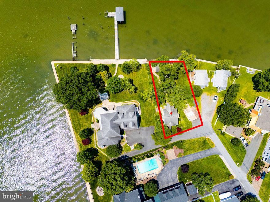 List price is Opening Bid at the Online auction to be conducted on Auctioneers website. Bidding begins Saturday, July 19th & ends Thursday, July 24th, 2025 at 1:00 pm. Custom Cottage with Panoramic Middle River Views & Versatile Shore Shack on Galloway Point in Bowleys Quarters. This 1,932± sq ft home on an 11,180± sq ft lot blends comfort and charm with waterfront living. The main level offers an open eat-in kitchen with island, cozy sitting area with fireplace, full bath, and covered rear porch. Upstairs, the primary suite features a fireplace, private balcony with river views, walk-in closet, and spa-style bath with soaking tub, shower, and laundry. Additional features include hardwood floors, updated furnace, and a detached shore shack with water and electric—perfect for entertaining, storage, or creative space. A covered backyard pavilion completes this inviting retreat.