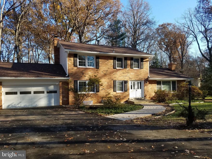 Wow!  Totally refreshed inside and out with new paint, new carpets, recessed lighting, new flagstone patio and walkway, and more!  Spacious rooms, updates galore, beautiful views out of every window, including three big picture windows!  Master bedroom has huge walk in closet and big bathroom!  Rare Main Level Bedroom can also be used as a wonderful office!  All set on a quiet double cul-de-sac in walking distance to elementary school.   BONUS;  LEAF REMOVAL AND GENERAL LAWN CARE AS WELL AS GUTTER CLEANING IS INCLUDED IN THE RENT!  Enjoy all the benefits of a quiet wooded lot without the work of it!!!  Wood Stove in Family Room is great for added heat too!  Still in process of finishing touches and will be cleaned professionally.