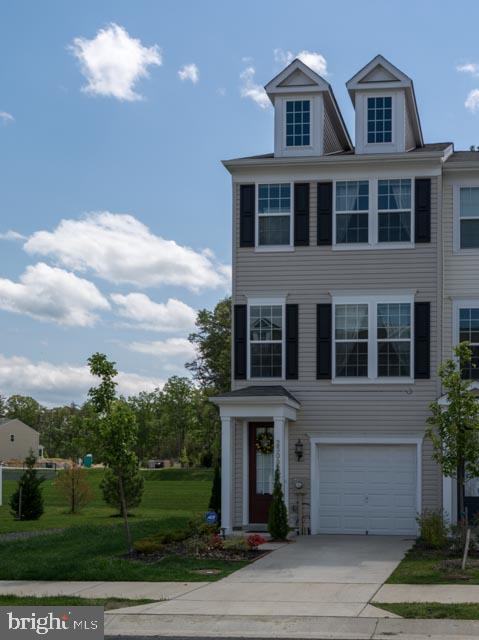 Three level end unit townhome with garage and driveway parking. Two bedrooms, two baths upstairs, one bedroom with full bath downstairs. Kitchen features stainless steel appliances, granite counters, gas range. Deck off of kitchen overlooks trees and community nature trail. Community amenities abound: community pool, jogging and bike paths, tot lots, basketball, tennis, and sport fields. Minutes to work, shopping, and entertainment.*Housing vouchers not accepted for this rental.*