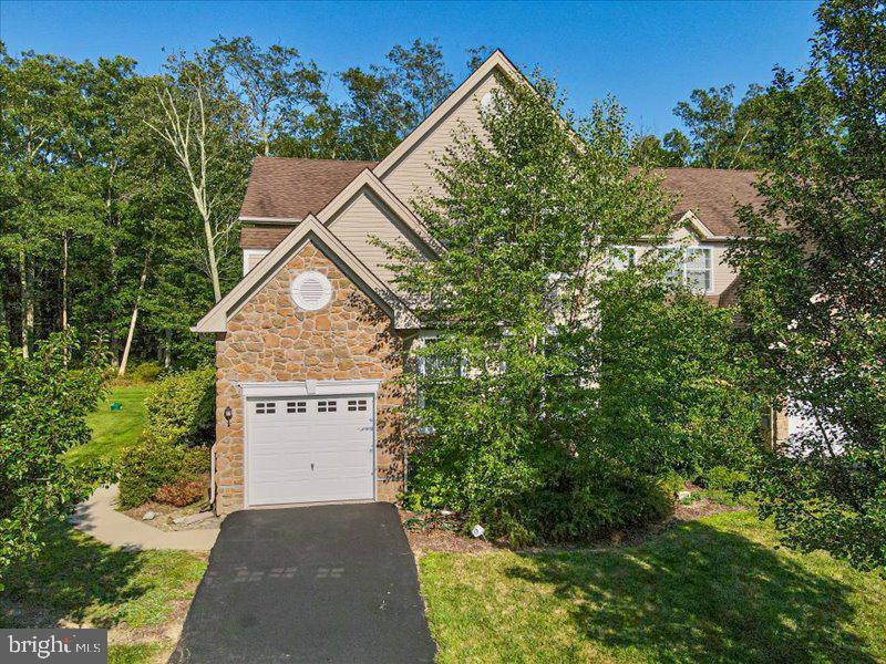 Experience Luxury & Maintenance Free Living in this END UNIT townhome in Country Club of the Poconos Golf Community! This 3 Bedroom 2.5 Bath LUXURY TOWNHOME boasts an abundance of NATURAL LIGHT, WOOD FLOORS throughout, PRIMARY BEDROOM ENSUITE AND LAUNDRY on the MAIN FLOOR, and the convenience & coziness of a GAS FIREPLACE in the living room! SPACIOUS Floor plan & WALKIN CLOSETS & LOFT offer the storage and room for your expanding family or guests! You will love the cozy breakfast nook and ample cupboard space in the kitchen! Enjoy BBQ on the back DECK! Home is also equipped with CENTRAL A/C, One Car GARAGE and ALARM SYSTEM! Convenient to shopping and 18 Hole 70 Par 5,902 Golf Course. The FULL BASEMENT is awaiting your finish for REC ROOM, HOME THEATRE, HOME GYM & 3rd BATHROOM!