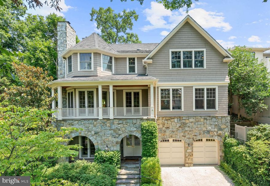 Ideally located on a highly desirable tree-lined street in the Kent neighborhood, this beautiful custom-built residence offers refined finishes at every turn. The house has commanding street presence with its attractive façade, featuring impressive stonework and charming archways. Upon entry, the grand foyer has stunning hand-painted silk wallpaper and a dramatic central staircase. For added convenience, there is also an elevator that services three floors. The main level features a grand hall that seamlessly transitions to the gracious living room and sitting room, which offer two fireplaces, soaring coffered ceilings, intricate moldings, and built-in cabinetry. A sizeable front terrace can be accessed from the sitting room through three sets of glass-paneled French doors, which flood the room with an abundance of natural sunlight. The nearby dining room, also enhanced with a coffered ceiling, includes built-in shelving, cabinetry, and a quaint side balcony. The heart of the home is the gourmet kitchen, equipped with top-of-the-line dual Sub-Zero refrigerators, two dishwashers, custom cabinetry, and a spacious walk-in pantry. The kitchen opens to a generous family room featuring a stone fireplace, built-in cabinets, and direct access to the rear terrace and beautifully landscaped backyard. The upper floors of this remarkable home are dedicated to luxury and comfort. The centerpiece is the impressive primary suite, which offers a spacious sitting room and dual closets, plus an additional cedar-lined closet for ample storage. The spa-inspired en-suite bathroom is the epitome of luxury, featuring dual vanities, a freestanding soaking tub, a separate walk-in steam shower, and elegant finishes to create a serene atmosphere. This floor also hosts two more well-appointed bedrooms, each with en-suite bathrooms and large closets. The bedrooms share access to a thoughtfully designed upper-level central family room. The top floor features two additional bedrooms that share a hall bathroom. On the entry level, there is a stately office/library with custom built-in bookshelves and an en-suite bathroom. This level also has an additional bedroom with an en-suite bathroom, a home gym, and garage access. The rear of the property is an entertainer's paradise, featuring an expansive flagstone patio with space for multiple seating areas and a lovely water feature. The beautifully maintained landscaping ensures exceptional privacy, providing the ultimate escape from city life. This custom-built home, with bespoke finishes and unparalleled attention to detail, is truly an offering unlike any other. It is also within close proximity to neighborhood restaurants, shops, and parks.