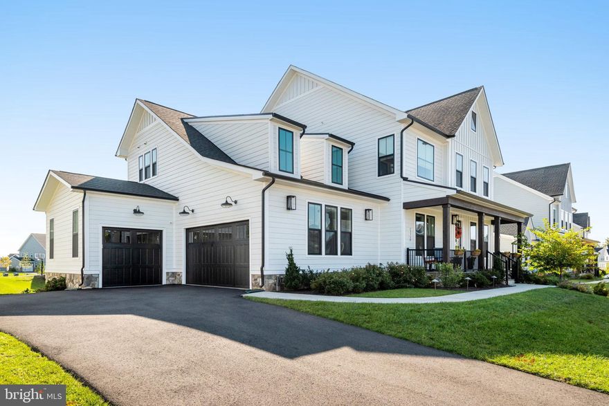 Don't miss this incredible opportunity to live in sought after HARTLAND community.  This beautiful Van Metre Belmont II model offers 6 spacious bedrooms, 4 Full baths, 1 half bath and a 3 car garage providing the perfect blend of functional space and modern touches.   The inviting open floor plan offers an abundance of natural light, 10' ceilings and gorgeous finishes.  The bluestone walkway and front porch creates an inviting and sophisticated entrance.   As you enter the spacious foyer, you'll find the  formal dining area, and a study, currently a music room, with French doors and custom built-ins.  Gather with friends and family in the warm and inviting great room with gas fireplace, adjoining a state of the art gourmet kitchen with large island, extended cabinetry, undercabinet lighting, oversized farm sink, quartz countertops, stunning backsplash, and luxurious CAFE appliances.  This model features not only a butler's pantry and wet-bar,  but also a thoughtfully designed walk-in pantry designed by Chef Spike Mendelsohn. The "Spiked Pantry" is accessed by a sliding barn door, and has plenty of shelving, and cabinetry, as well as a second sink and additional CAFE Dishwasher and wine refrigerator.  You'll also find a bonus room/office/study on this level as well as a mudroom with  spacious cubbies and cubicles for organizing  your day to day life.  The 3 car garage is finished, with Epoxy flooring and EVC receptacles.  At the rear of the house you'll find a maintenance free deck.  Enjoy your morning coffee, al fresco dining and grilling on your gas grill that's already affixed to the natural gas line.  (Grill will convey).
On the upper level you'll find a beautiful owner's suite with an abundance of windows, sitting area, 2 spacious walk-in closets, tray ceiling with stylish lighting, a stand-alone bathtub, oversized  multi-head shower, dual sinks and separate commode. 
 The secondary bedrooms are quite spacious.  A Jack and Jill bath with dual sinks separate  the 2nd & 3rd  bedrooms and you'll also find a generous and private Princess suite.   The convenient laundry room with a utility sink as well as a walk-in linen closet can also be found on the upper level.  
The lower level has plenty of space to entertain or just relax with family.  There are 2 additional bedrooms on this level, a full bath, storage and walk-up to rear yard.  Note: There is a rough in for a second full bath on the lower level. 
 Everything has been done for you! Irrigation system, exterior illumination, Cellular shades for privacy and temperature control. Embrace a lifestyle of opulence and functionality in this meticulously maintained home. 
Hartland provides easy access to Loudoun County Schools, Dulles International Airport, major commuter routes, local shopping and dining, wineries and breweries and more.