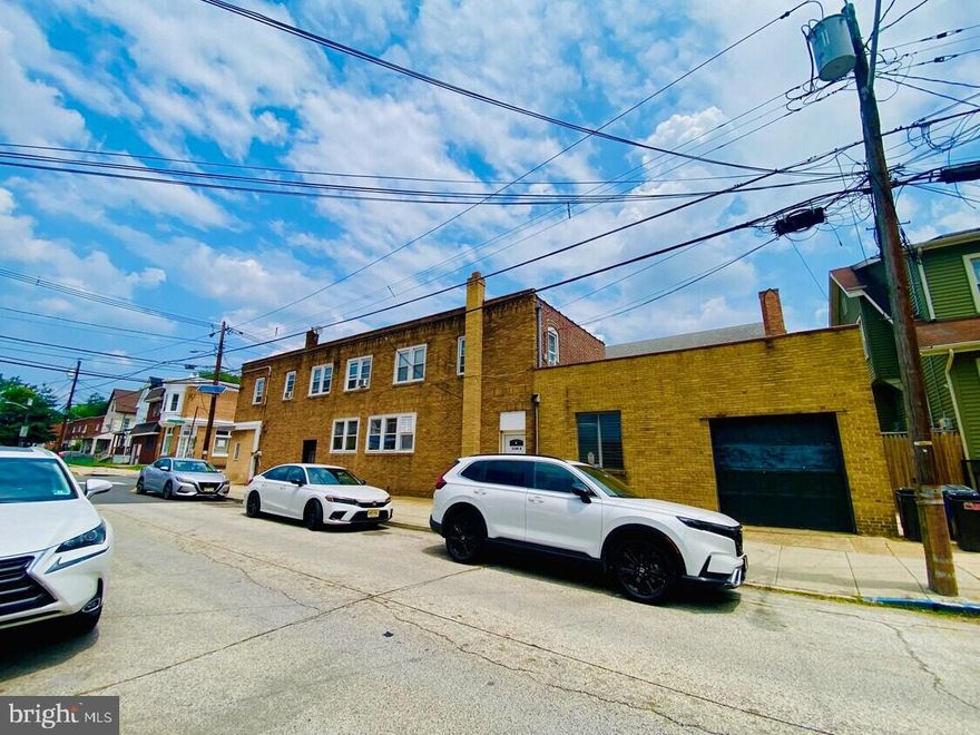 Versatile 2,800 Sq. Ft. Mixed-Use Property in Prime Downtown Woodlynne Location Situated on a prominent corner lot at Woodlynne Ave & Chestnut Ave, this two-story brick mixed-use building offers excellent visibility and convenience—just 10 minutes from Center City Philadelphia, major bridges, and easily accessible via Route 676 and Route 295. Property Highlights: Total Building Size: Approx. 2,800 sq. ft. First Floor Commercial Space: Approx. 1,200 sq. ft. Previously used as office/professional space and a bakery Layout includes private front offices, five large multi-purpose rooms, garage access at rear Features include 10 ft. ceilings in some areas, replacement windows, basement area, restrooms, and storage closets Separate entrance and utilities Second Floor Residential Apartment: Approx. 1,000 sq. ft. Spacious 3-bedroom, 1-bath layout with eat-in kitchen Large living room (13' x 21') Long-term tenant in place Private entrance and separate utilities Additional Features: On-street parking available Ideal for: Live-in professionals Owner-occupants seeking income offset from the upstairs tenant Investors and entrepreneurs looking to reimagine a flexible, generously sized floorplan With its high-traffic corner location, solid brick construction, and a versatile layout, this property is full of potential—perfect for a variety of professional, retail, or residential uses.