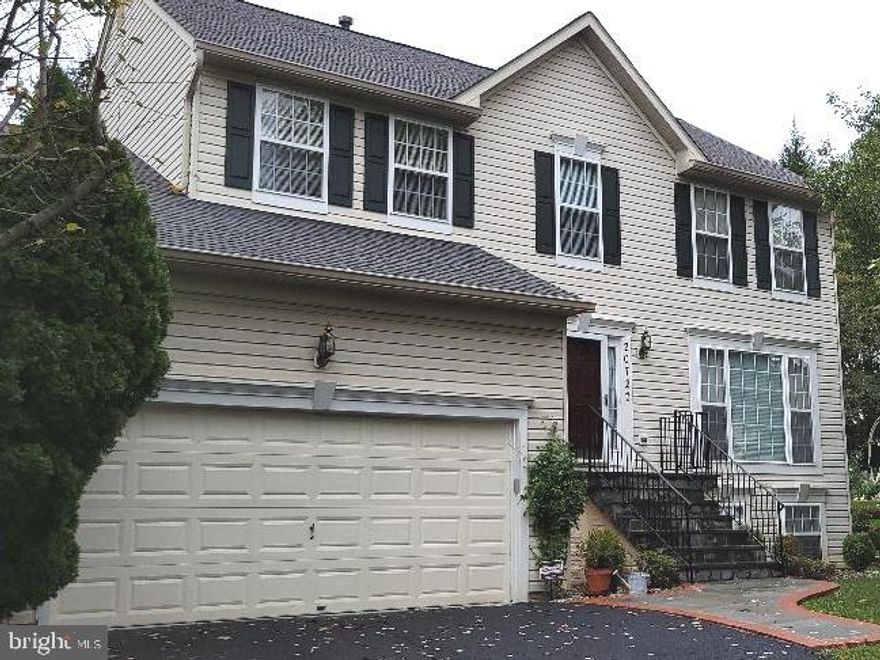 Fantastic move in ready 5 Bedroom 3.5 Bath house in sought after Seneca Estates section 2, Germantown.  Close to Milestone shopping center,, public transportation, Montgomery college (Germantown campus) Holy Cross hospital.
This home offers a great layout.  Stunning hardwood floors throughout plus crown moldings add to this classic beauty.  Main level offers an inviting living area,  convenient laundry facilities, kitchen , rear exit and garage entry. A spacious family room, ready for gatherings around the gas fireplace during chilly evenings awaits.  Continue to the upper level and you will find, 4 bedroom and 2 full bathrooms. Enter the owner's ensuite and your greeted with sunlit room, high ceilings, wood floors and custom built shelving in the walk-in closet. Stroll to the lower lever, its home to an expansive recreation area, suite -- bedroom and full bath, kitchenette, ample storage and a walkout basement exit. Landscaped backyard with patio, blooming bushes, flowers and trees. Area can host barbecues or simply relax and enjoy the privacy.  *********Roof replaced in 2018, furnace is 10 years old.  ***********One year Home Warranty for buyers paid by seller.  Outside electrical lines are underground to guard against power outages.
With a Two car attached garage with remote control, and 4 car drive way, buyer has plenty of parking and storage.