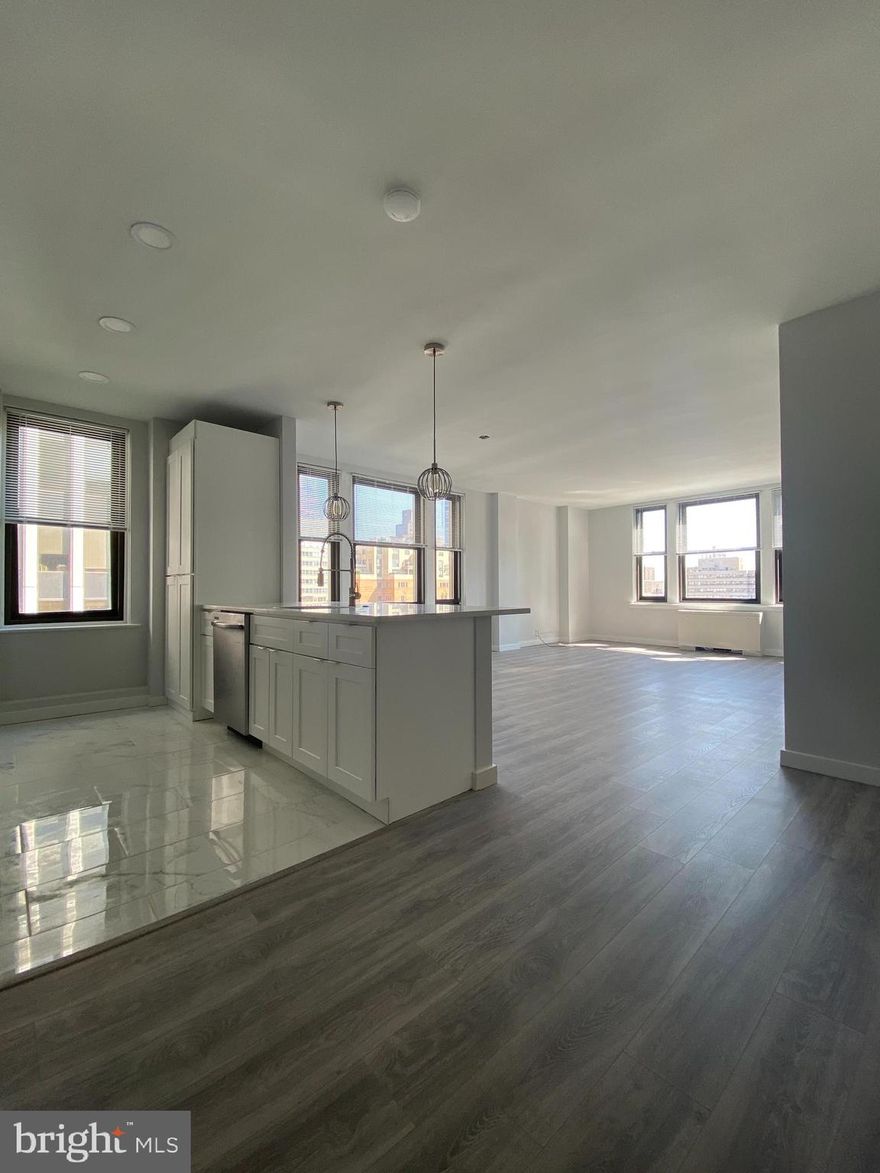 Beautifully renovated two bedroom, two bathroom home with treetop views of Rittenhouse Square! Unit 1611 is located on the penthouse floor of The Wellington with south-facing views. This home features a completely renovated eat-in kitchen with white shaker cabinetry, granite countertops, and stainless steel appliances, including a dishwasher. The master bedroom features an ensuite bathroom with a single vanity and a stall shower. The second bedroom has access to the full hall bath with a single vanity and a shower/tub combination. Both bedrooms have excellent closet space. There are also "wood-like" laminate floors throughout.   Residents of The Wellington experience a 24-hour doorman and on-site management.