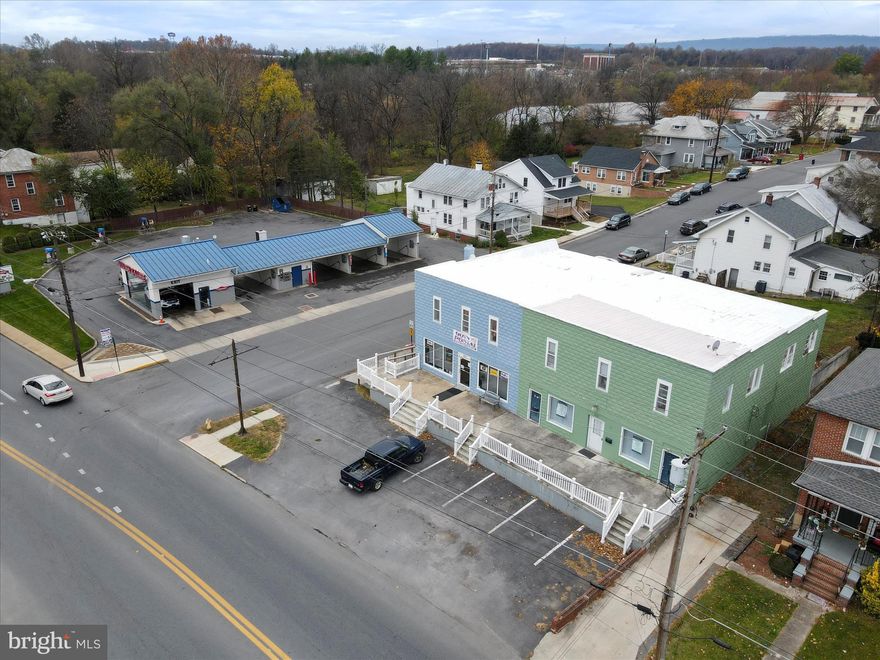 Great commercial/residential mixed use opportunity in the outskirts of Martinsburg.  Entire building is under contract to be settled this summer.  We are looking to fill the empty space consisting of 1800 sq ft of office, retail, salon, or other types of suitable uses.  There are 5 smaller offices in the rear and a large showroom in the front.  There is one bathroom in place and one roughed in.   There is front and rear access and parking lot out front.  There is rear parking for employee use.