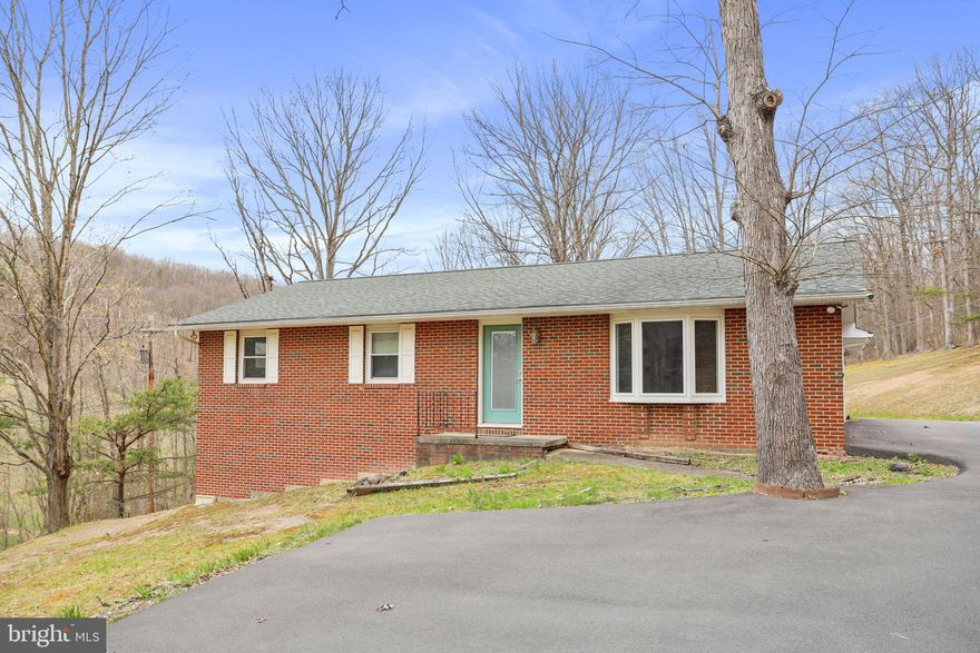 Beautifully maintained brick Ranch home with 3-bedroom & 2-full bathrooms situated on 4.4 private wooded acres.  Large kitchen, family room off kitchen, propane gas fireplace and hardwood floors throughout. Make your appointment today!