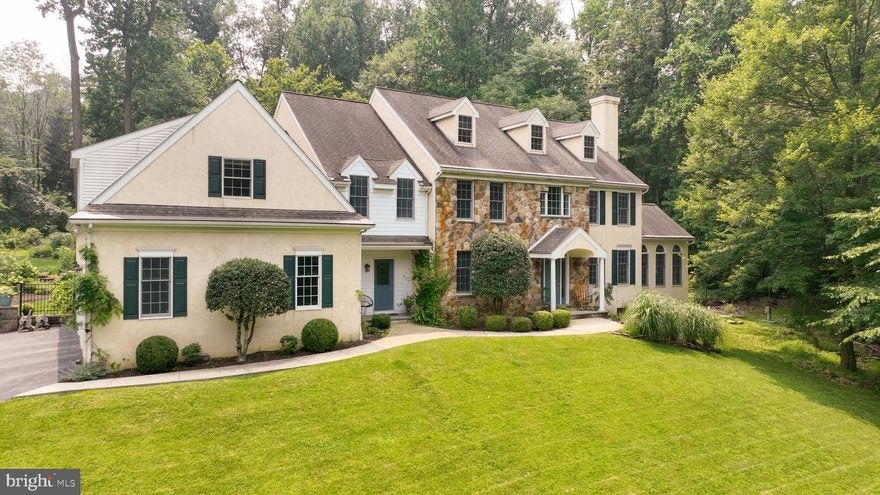 Welcome home to 4097 Howell Rd, a Charlestown Township custom built (2004) single-family home in the Great Valley School District nestled in Chester County in Malvern PA. This home boasts approx 6,325 SqFt of thoughtfully designed space on a beautifully manicured private 2 acre lot; it has all the space you need for comfortable, peaceful living.  The main floor greets you with an inviting entrance way that leads to a formal dining room with crown molding and chair rail, a formal living room with a double-sided propane gas fireplace, and a sunroom with arched windows that provide natural light and a view to beautiful grounds as well as a fireplace.  The main floor also includes an office; a welcoming family room with vaulted ceiling and wood fireplace that sits off the custom kitchen and breakfast area. The kitchen has propane gas cooking, GE Monogram appliances, a Bosch dishwasher, built-ins and ample cabinetry for storage along with a walk-in pantry. The main floor also has a mudroom with laundry, and a powder room.   Beautiful hardwood floors throughout the entire main floor and two staircases, one from front foyer & one from breakfast area, to take you to the second floor are some of the details that make this home stand out.  The upstairs is home to 5 generously sized bedrooms.  The 5th bedroom in particular could be split into two rooms, as it's quite large, should there be a need for a 6th bedroom.  The primary bedroom has an en suite and massive walk-in closet with dressing area along with two other closets.  Two bedrooms share a Jack and Jill bathroom. The basement was designed with entertaining as the focus.  Everything from a bar and wine fridges to game room, TV area, and workout/sauna area, and a powder room.  So many ways to use the space in the basement. The basement also has significant storage. Car enthusiasts will appreciate that not only is there a 3 car garage attached to the home, but there is also a detached 3 car garage w/ electricity, hot water, and heat.  The detached garage has an unfinished loft area big enough to provide many uses the next owner may want; such as, additional living space, an art studio, office, or simply more storage.  The home is surrounded by landscape and hardscape that make the exterior as enjoyable as the interior.  Gardens, patio, deck, and wooded area for privacy.  The front yard sits well off the road.  Charlestown is surrounded by beautiful parks, golf clubs, open spaces,  and the Great Valley public schools.  Easy access to the PA Turnpike, Rts 202, 30, & 29 plus Corporate campuses.  Be sure not to miss out on this stunning property and schedule your tour!