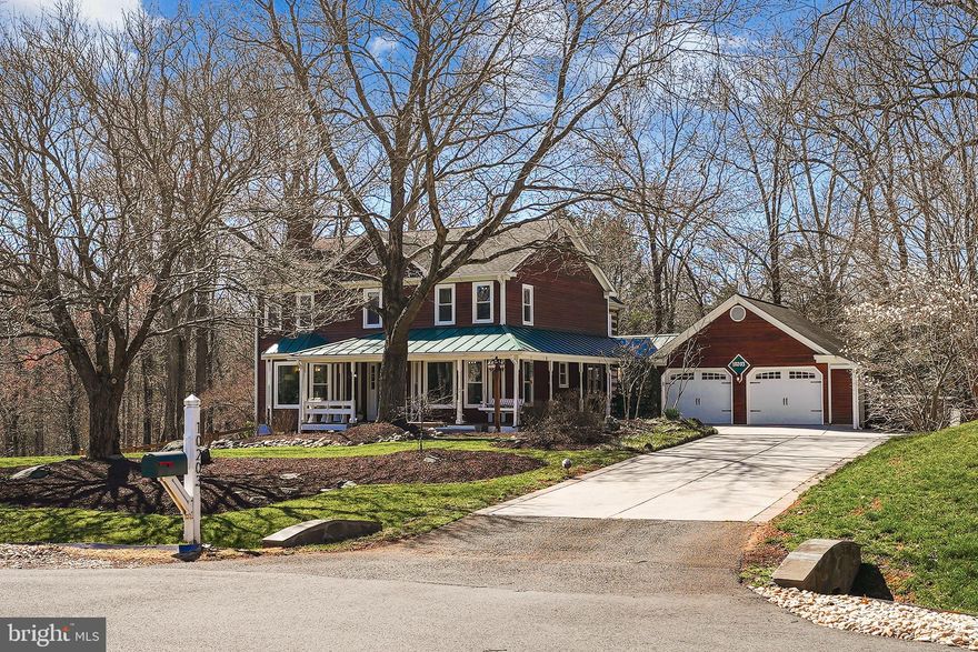 Tucked away on a serene cul-de-sac in the prestigious Colvins Glen community (no HOA!), this charming 7-bedroom, 5-bathroom rustic farmhouse offers over 4,200 square feet of refined living space on an expansive and private .57-acre lot. Zoned to the highly acclaimed Langley High School pyramid, this rare property blends natural elements with modern upgrades and enjoys an idyllic setting backing to Colvin Run Mill Park’s 32 acres of protected wooded trails that lead to Lake Fairfax and beyond.

From the moment you arrive, you're captivated by the delightful curb appeal—mature trees, inviting paver walkways, and a wrap-around porch adorned with a picturesque metal roof and classic porch swing. Inside, a sun-drenched and thoughtfully designed floor plan offers seamless flow and versatility, with dedicated spaces to suit every family's lifestyle. The upper level features four generously sized bedrooms, including a sprawling primary suite with a beautifully renovated en-suite bath (2024) and a custom-built walk-in closet (2024), a secondary bedroom with private bath, and two additional bedrooms joined by a spacious Jack-and-Jill bathroom. A large upper-level laundry room adds everyday convenience. The main level office is a bedroom with a shared full bath. The lower level includes two additional bedrooms, ideal for guests, an au pair, or home gym, alongside a newly finished full bath and an expansive recreation space.

At the heart of the main level is a formal living room with a bay window overlooking the front yard, enhanced by elegant trim work, a wood-burning masonry fireplace, and abundant natural light. French doors open to a private study or library, complete with custom built-ins and a warm pine desk that echoes the earthy tones found throughout the home. Across the foyer, the formal dining room showcases another bay window and provides direct access to the fully renovated gourmet kitchen (2020), featuring quartz countertops, custom cabinetry with under-cabinet lighting, black stainless steel appliances with gas cooking, and a cozy breakfast room with built-in bench seating. Off the breakfast area, step into the show-stopping log cabin-style family room, highlighted by exposed beams, stacked wood walls with authentic chinking, and a storybook stone fireplace. This space opens to two separate decks, perfect for al fresco dining or entertaining under the stars. The walk-out lower level, fully renovated in 2020, offers a spacious recreation area, guest accommodations, a full bathroom, and generous storage with both a walk-in closet and a shelved utility area.

Set on one of the neighborhood’s premier lots, the backyard is a true woodland retreat—featuring a run-in shed for garden tools, raised garden beds, a charming bridge walkway over river stone landscaping, a dedicated play area with playset, and lush mature vegetation throughout.

With close proximity to Tysons, Reston Town Center, Dulles Airport, Great Falls Park, Wolf Trap Center for the Performing Arts, and major commuter routes, this home offers luxurious living and unmatched convenience in one of Northern Virginia’s most coveted communities.

CAPITAL IMPROVEMENTS & NOTABLE ELEMENTS: NO HOA, Langley HS Pyramid (US News Ranking) - Colvin Run Elementary School (#12 of 1,782) - Cooper Middle School (#9 of 1,043) -  Langley High School (#2 of 329), Public Sewer & Water, Natural Gas & Fios, Full interior paint throughout (2024), Primary Bath & Closet (2024), Full Window Replacement (2024), Upper Level HVAC (2023), HVAC Humidifier - Lower & UV Lights (2023), Finished Lower Level (2020), Kitchen Renovations (2020), Main Floor Bath (2020), Fencing (2020), Garage Doors (2020), Water Heater (2020), Lower Level HVAC (2016), Full Roof Replacement (2011)

Don’t miss this extraordinary opportunity to own a private retreat in an unbeatable location—schedule your private tour today!