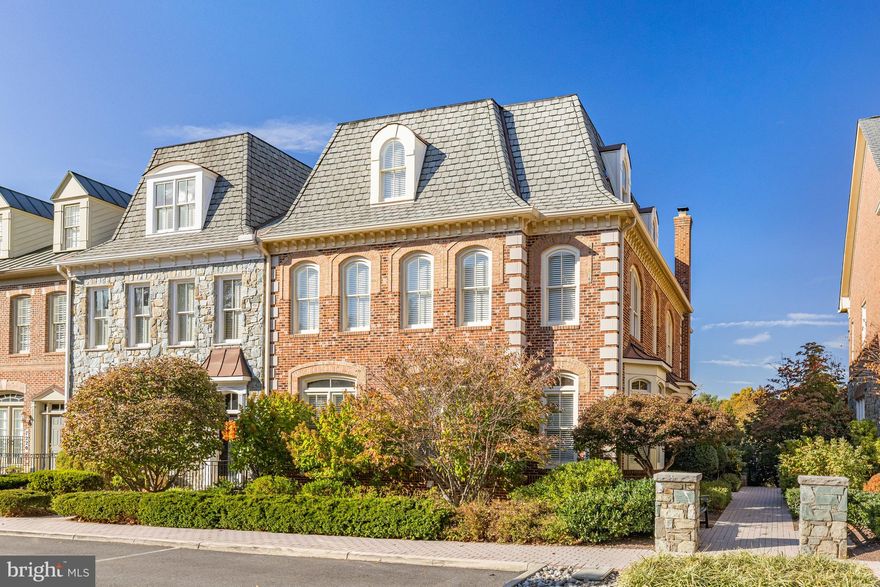 If you are looking for a generously sized, well appointed end-unit townhome that lives like a single family home, welcome to 7218 Farm Meadow Court in Evans Farm!  With just one owner since the home was originally built, this exceptionally well maintained 4 Bedroom, 5.5 Bathroom Georgian-style all-brick Belvedere model with Elevator, three fireplaces, a 3-car garage, and thoughtful design elements throughout, offers a coveted "lock-and-leave" lifestyle with convenient access to Tysons, downtown McLean, and points beyond.   Situated on one of the most desirable lots in the neighborhood, the home overlooks a serene pond and rests along a tree-lined, dead-end street. 
The two-story Foyer welcomes you with an elegant curved staircase and opens to a main level designed for entertaining and everyday luxury. Hardwood floors and crown molding extend throughout, creating a timeless ambiance. The chef’s Kitchen is outfitted with Viking, Sub-Zero, Bosch, and KitchenAid appliances, an expansive breakfast bar island, and opens to a relaxing Family Room with a wood-burning fireplace and a sunny breakfast area. Step outside to the enclosed brick patio, complete with a natural gas hookup for grilling. The main level also features a formal Dining Room and Living Room as well as a Great Room extension at the back of the home with a gas fireplace, ideal for casual gatherings or special occasions.
The upper levels provide spacious and light-filled accommodations. The Primary Suite is a retreat unto itself, with a tray ceiling, a sitting room, and two walk-in closets. The Primary Bathroom features marble finishes, dual vanities, 2 water closets, a soaking tub, and a glass-enclosed shower. Two additional en suite Bedrooms and a generous laundry room complete the first upper level. On the second upper level, a fourth Bedroom, full Bathroom, and a versatile Loft offer additional space for guests or a private retreat.
The expansive lower level is designed for relaxation and functionality. A large Rec Room with custom wet bar and a gas fireplace serves as the centerpiece, complemented by a dedicated exercise room and a full Bathroom. Additionally, the lower level offers finished storage space to keep your home organized and clutter-free.
Located minutes from the McLean Metro stop, Capital One Center with Wegmans, Tysons Galleria, The Ritz-Carlton, and The Boro with Whole Foods, this residence offers unparalleled convenience. Commuting is simplified with easy access to I-495, I-66, the Dulles Toll Road, and the GW Parkway, while both Dulles International and Reagan National airports are within a 20-minute drive.
This home combines easy living, an unbeatable location, and the best of McLean and Tysons.