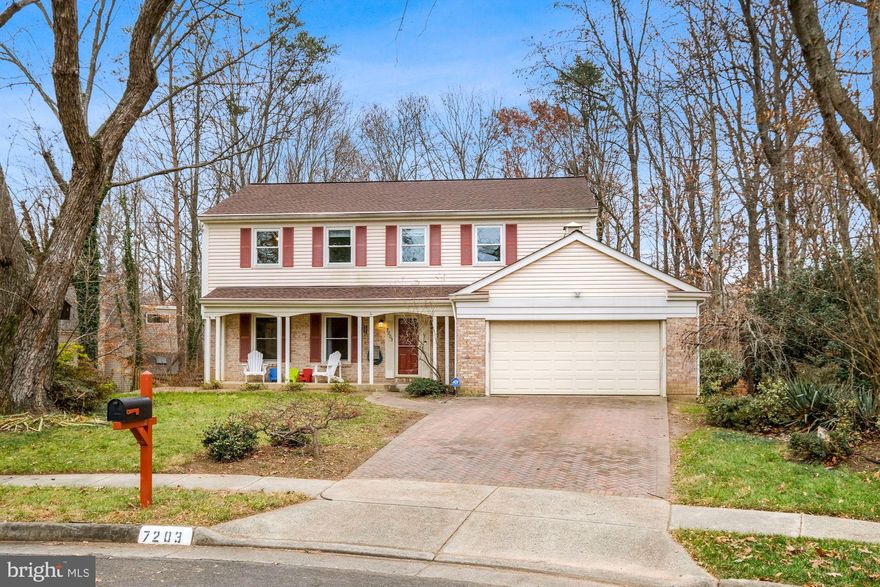 Welcome to 7203 Hopkins Court, a beautifully maintained single-family home on a quiet Springfield cul-de-sac. This charming home features a cozy front porch, perfect for morning coffee or evening relaxation.

Inside, you'll find a bright and spacious living area with a neutral color palette. The formal dining room overlooks a serene, wooded backyard. The chef’s kitchen boasts recessed lighting, upgraded countertops, stainless steel appliances, and white cabinetry, with plenty of storage and space for a breakfast table. Step onto the private deck to enjoy peaceful views of the woods.

Adjacent to the kitchen, the formal living area features a brick fireplace, built-in bookshelves, and stunning backyard views. A half bath completes the main level.

Upstairs, there are four spacious bedrooms and two full bathrooms. The primary suite includes a walk-in closet and an updated en-suite bathroom with upgraded countertops and a sleek stall shower with a framed glass door. The additional bedrooms share a well-appointed hall bath.

The walk-out basement provides extra living space, a laundry area, and a generous storage area. The fully fenced, flat backyard backs to private woods, offering tranquility and privacy.

This home is perfect for commuters, with easy access to I-95, I-395, I-495, and Fairfax County Parkway. The Franconia-Springfield Metro Station and nearby bus routes provide convenient public transportation.

Enjoy all Springfield has to offer including Lake Accotink Park and Springfield Town Center just minutes away. Parks, trails, and recreational facilities add to the appeal of this prime location.