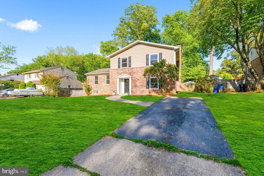 **OPEN HOUSES SAT 5/9  1-4PM & SUN 5/10 12-3PM & 3;30-5;30**This beautifully reimagined four-level split features over 2900+ sf of luxury living space and offers the perfect blend of modern upgrades, thoughtful design, and everyday functionality. Featuring 5 bedrooms and 3.5 baths, the home has been completely renovated with a focus on quality craftsmanship and seamless indoor-outdoor living. The fully fenced rear yard is a true highlight—designed for entertaining and relaxation with a covered brick paver patio and added patio spanning the full length of the home, a large storage shed, and a custom-built playhouse. Off-street parking adds convenience, while the outdoor spaces create an inviting extension of the home’s living areas.

Inside, the main level showcases a stunning open-concept layout anchored by a gourmet chef’s kitchen, rebuilt from the ground up in 2023. Outfitted with quartz countertops, upgraded shaker-style soft-close cabinetry, stainless steel appliances, a custom tile backsplash, and built-in pantry, the kitchen flows effortlessly into the living and dining areas. A striking wood-burning fireplace with a floor-to-ceiling custom stone hearth serves as the focal point, complemented by newly installed ceramic tile flooring, modern recessed and pendant lighting, and a fully renovated powder room.

The upper levels provide exceptional flexibility and comfort and boast newly refinished, hardwood floors throughout. A private primary suite added in 2023 features vaulted ceilings, a spacious walk-in closet with custom built-ins, a dressing area, and a beautifully appointed en-suite bath with a dual vanity and a custom tiled walk-in shower. Four additional bedrooms—each with hardwood floors and updated lighting—offer generous space for family, guests, or home office needs. Two fully renovated bathrooms, including a guest suite with its own en-suite bath and walk-in closet, enhance both convenience and privacy.

The lower level adds even more versatility with an open area ideal for additional living, working or storage space along with a private walk-up entrance and recently updated full-size washer and dryer. Additional improvements throughout the home include replaced dual-pane windows and doors, updated recessed and decorative lighting, replaced vinyl siding, a newer roof (2011), and a brand-new water heater (2026). Ideally located less than a mile from the METRO Red Line, and just a block from parks and trails, this home offers unmatched accessibility to shopping, dining, the ICC, I-495, and major commuter routes, as well as easy access to Baltimore/Washington International Airport, Dulles International Airport, and Reagan National Airport—making it a truly exceptional offering in a prime location.....Welcome Home!