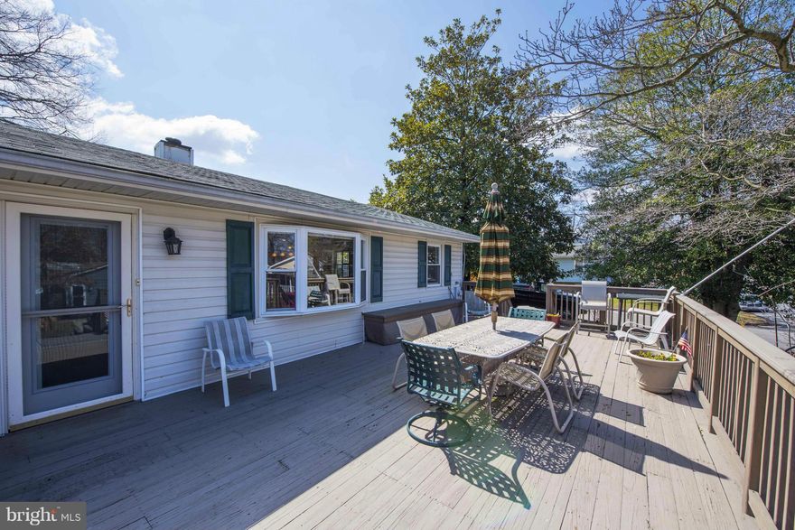 The WOW is in the Open Kitchen and Family room design--Pantry, granite island, stone sink, and island drawer appliances--Family/Dining with cozy pellet stove--plantation shutters--small 2nd room for possible bedroom/office--fenced rear yard--shed--large front deck for entertaining--Concrete driveway with ample parking--Heated garage--1/2 bath is in the garage. Owner has invested $100K+ in upgrades