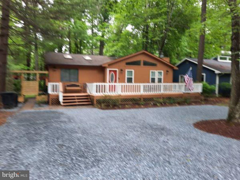 This inviting ranch-style home in the heart of Ocean Pines Resort offers the ideal combination of comfort, style, and convenience. Step inside to discover a bright, open floor plan with an updated kitchen and bathrooms. The home features four spacious bedrooms and three full baths, including two bedrooms with private en-suite bathrooms and a third full bath located off the hallway for added convenience.
The cozy living room is warmed by an electric fireplace, creating a welcoming space to unwind. Just outside, a large deck provides the perfect setting for outdoor dining and entertaining, while an outdoor shower—located to the left of the house—makes beach clean-up a breeze. With ample parking and a front-load washer and dryer, this home is designed for easy, relaxed living.
Situated near the community center, park, and playground, the property offers access to a wide range of amenities. For a small fee, residents and guests can enjoy five community pools, tennis courts, a marina, and an on-site golf course. Ocean City is just a short 15-minute drive away, where you can stroll the boardwalk, soak up the sun on the beach, or enjoy family-friendly attractions like the Ferris wheel at Jolly Roger at the Pier.
Whether you're seeking a full-time residence, a weekend escape, or a vacation rental investment, this Ocean Pines gem delivers the very best of coastal living