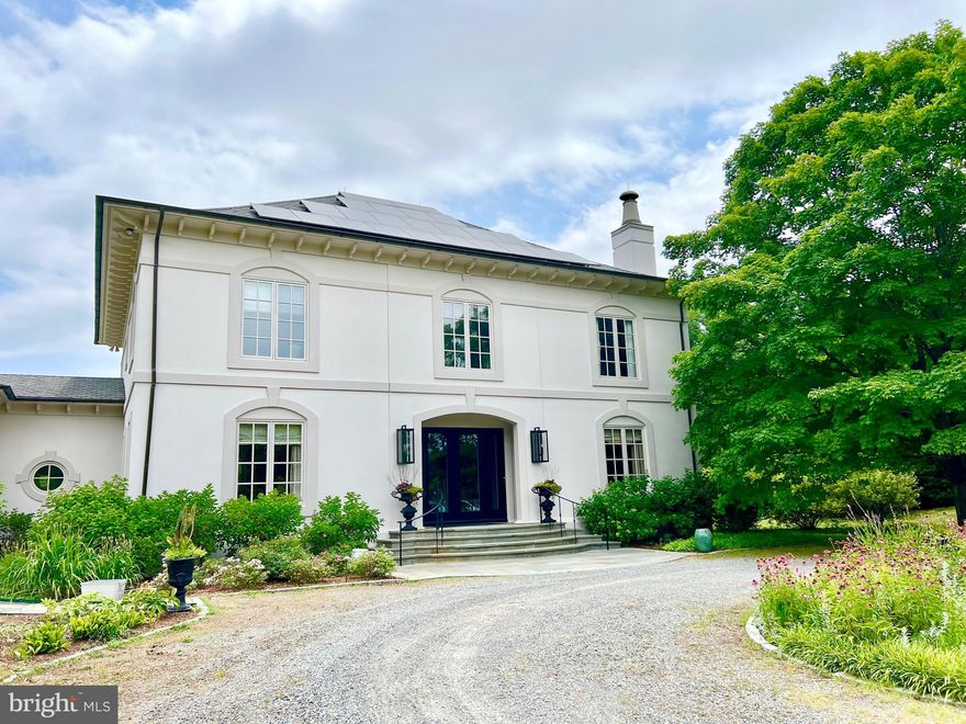 Back on the market, due to no fault of the seller.  Serenity Farm welcomes you to its 109 acres with beautiful fields surrounded by majestic oaks and other hardwoods. The estate features a sophisticated 4-bedroom French Country Chateau, complemented by a screened porch and multiple flagstone terraces surrounded by perennial flowers. Step through the front doors to the grand foyer with its spiral staircase and admire 10 ft ceilings with heavy custom crown moulding, throughout the home, and arched doorways on the first floor. Enter the living room with marble surround fireplace. Walk into the library with built-in shelves and cabinets on 2 walls, another fireplace and accesses to the screen porch. Continue through the casual dining room with more built-ins and closets and enter the gourmet chef’s kitchen, featuring a large island with a Wolf gas cooktop and downdraft vent, double ovens, built-in Sub-Zero refrigerator, breakfast nook and large laundry. Wander across the hall to the classic dining room with its stunning new lighting. Ascend the stairs to the huge primary bedroom, which features double closets and lots of natural light. The primary bath has a large double vanity, steam shower, separate tub and large closet. The 4th bedroom has built-in floor to ceiling cabinets for possible office. There is space for a future elevator using the hall closets. The property also boasts solar power and new heat pumps, a golf hole out back with sand traps and also a dedicated gas grill line.  Additional features include a charming detached studio with patio and retractable pergola, pump house nearby with half bath, elegant in-ground saltwater pool, large yoga deck, chicken coop and another garage and shed. The extensive landscaping, with irrigation systems in the garden and back yard, creates a lush, vibrant environment. Stroll through the woods to the 2-acre pond, perfect for tranquil moments or recreational activities. Fields of wildflowers enhance the natural charm of the property. Land Use farming has reduced the taxes to $5588/year. This property offers endless possibilities. Whether seeking a private retreat or elegant estate to entertain, enjoy this timeless testament to luxury and nature's beauty.