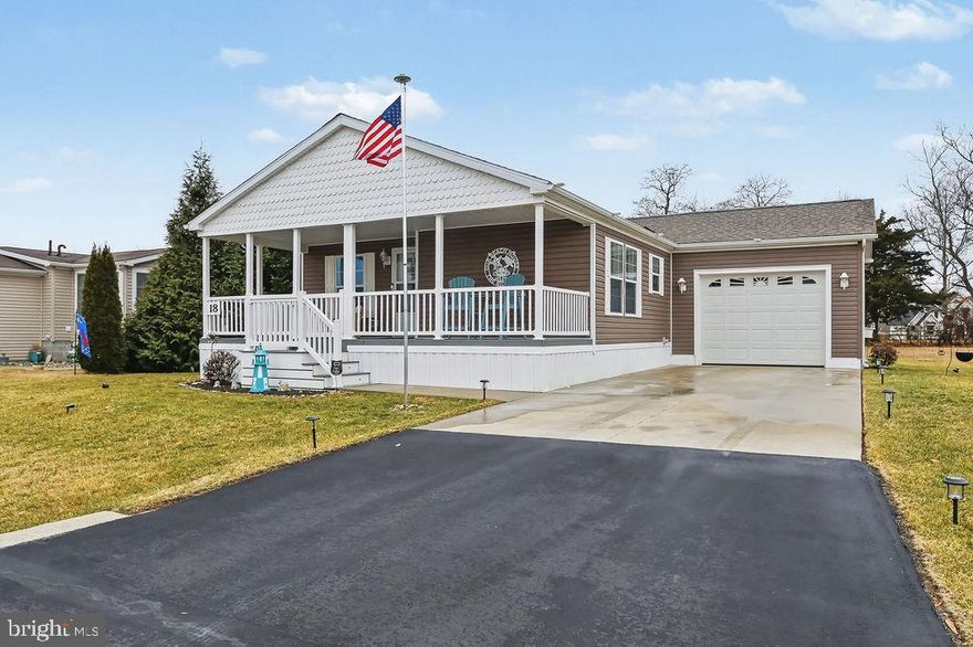 Welcome to 18 Buckingham Drive, Lewes De 19958!!!!!  This 55 and older community is one of the nicest communities in the Lewes area.  The well kept home was built in 2018, features 3 nice sized bedrooms, 2 full baths, freshly painted throughout with white cabinetry and stainless appliances.  The living room and dining area are right next to the kitchen area.  There is a mud room/laundry room off the kitchen that leads to the one car garage for extra storage or parking during these cold winter months!!!  The outside of the home is extremely private in the rear of the home, backing to some mature trees.  The front porch made with trek deck, is a great place to sit back and enjoy the sunsets!!!  This community features an indoor salt water pool, dog park, bocce courts, horseshoe pits, RV storage, street lights, trash pickup, snow removal, clubhouse rental available and state of the art security cameras throughout the community.  If you are one to adventure out, ride or walk to the Lewes to Georgetown trail located right behind the community!!!