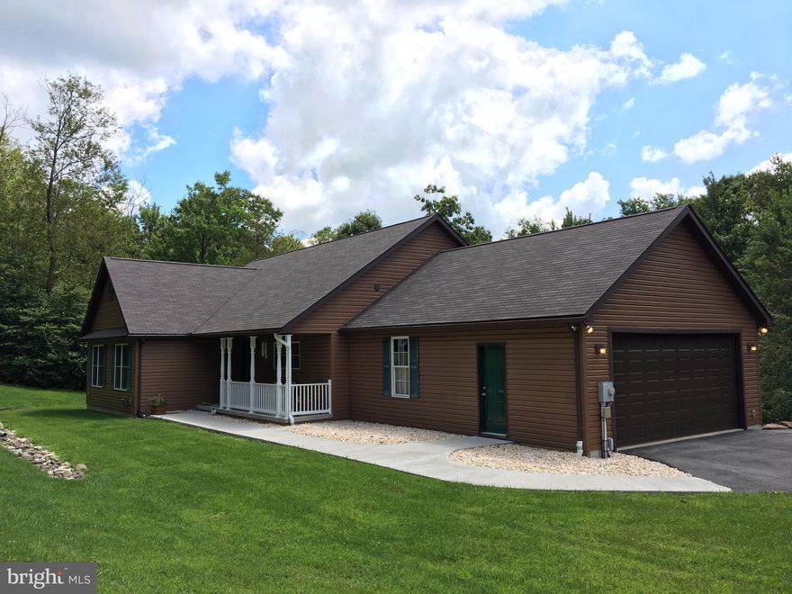 Lovely, 3BR Rancher on 16 acres built in 2006. This is one level living at it's finest! Featuring; an open floor plan,lg breakfast bar, main level laundry, a 3-season sun porch, central A/C, 2 car attached and 2 car detached garage. Conveniently located near I-68 yet very private and neat as a pin!!