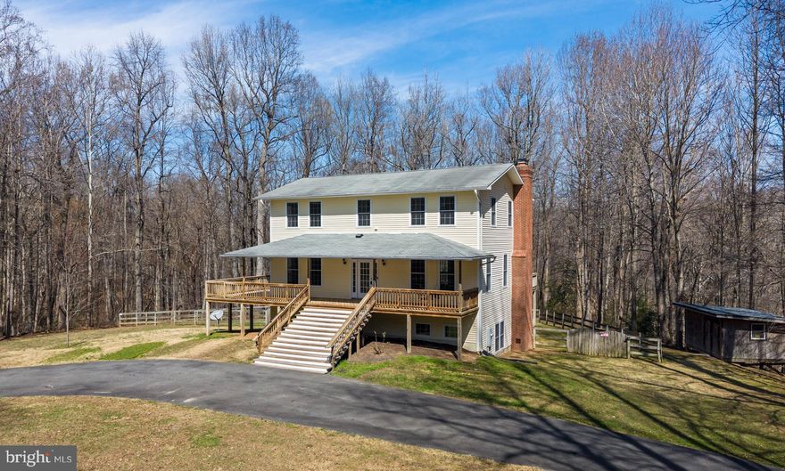 A Private Country Retreat on Nearly 14 Wooded Acres. Discover the perfect blend of charm, privacy, and nature in this beautiful country colonial, nestled on 13.96 acres of serene, wooded landscape. Tucked away from the world yet close to key destinations. Step inside to find 4 spacious bedrooms, 3.5 baths, and hardwood flooring throughout the main level. The finished basement—complete with a mini kitchenette, full bath with a new tub/shower (2024), and W/D hookup—adds versatility for guests, hobbies, or extended living. One of the standout features is the full wraparound porch, inviting you to enjoy nature year‑round. Whether you’re sipping coffee on a quiet morning or exploring your own wooded trails, this property delivers a true retreat experience. Very private setting with circular driveway, Fenced backyard and storage shed. New hot water heater (2023) New heat pump (2023) Kitchen updates: refrigerator, double oven, ceramic cooktop (2019). Perfectly located near Dahlgren Naval Surface Warfare Center, Indian Head Naval Base, and several parks including Dahlgren Wayside, Barnesfield, and Cedell Brooks. Southern Maryland is just minutes away. This unique property offers the rare combination of acreage, privacy, and convenience. A true gem for anyone seeking a peaceful lifestyle surrounded by nature. Welcome to 7403 Colross Glen Drive!