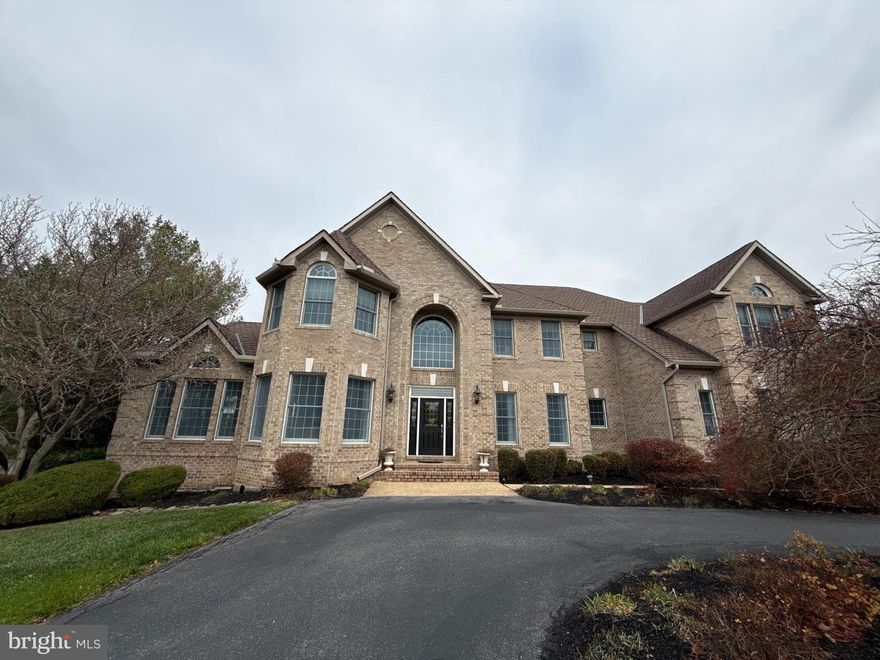 COMING SOON — an exceptional estate residence on a private 3+ acre homesite in sought-after Clarksville, offering a refined blend of timeless elegance and resort-style living. Spanning 5,669 finished square feet, this impressive home features grand entertaining spaces, including formal living and dining rooms, a soaring two-story family room with dramatic arched windows and a two-sided fireplace, a sunroom, a private study, and a beautifully appointed kitchen with a circular breakfast room. // The opulent primary suite offers a luxurious retreat with a sitting room and spa-inspired bath, while the walk-out lower level provides expansive recreation and flexible guest living space. Outdoors, enjoy lush manicured grounds, a private circular driveway, an expansive deck with a gazebo, a lower patio, and an in-ground pool designed for effortless entertaining. // 13003 Twelve Trees Court is a remarkable offering where privacy, scale, and sophisticated living converge. Additional details coming soon.