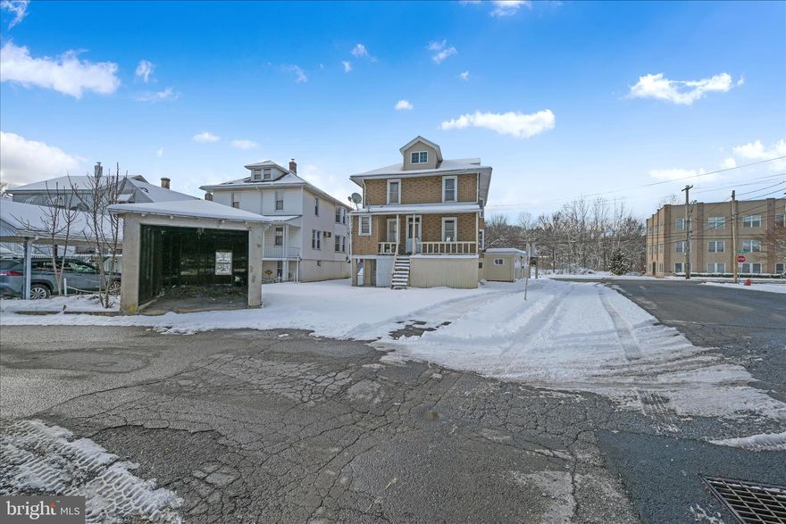An immense investment opportunity in the heart of downtown Schuylkill Haven awaits at 200 W Main Street. This large, detached home sits proudly on a prestigious corner lot and offers incredible flexibility for residential, commercial, or mixed use potential. Featuring both a basement garage and a detached garage, the property provides ample parking and storage rarely found in this location. A separate office entrance and dedicated parking create the perfect setup for a home office, small business, or professional suite. With its generous footprint and prime visibility, this property presents endless possibilities for the savvy investor or owner occupant. The blank canvas is here now it is time to start drawing.