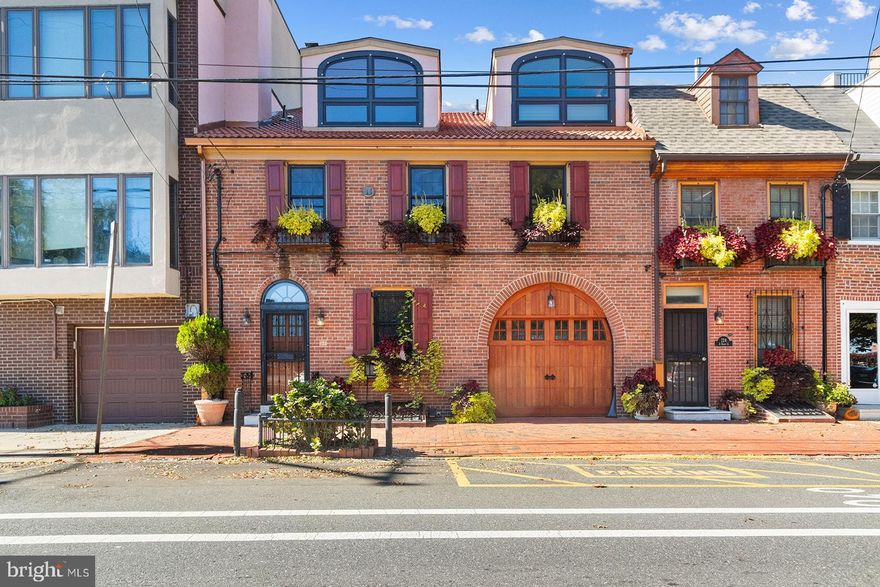 This one-of-a-kind Queen Village home in the Meredith Catchment sits on a double wide lot that spans 2 addresses and overlooks the Delaware River directly across from green space which is perfect for picnics, your dog, or lawn games. Before you even walk in you will notice the meticulously kept brick façade with beautiful bespoke garage door, wrought iron details, and custom window box planters.  

Entering through the front door there is a coat closet immediately to your left.  Beyond the landing a large sitting room is currently used as an office but could also be a playroom, den, or gym.  Just past this room is an open concept dining room and kitchen.  The dining room has a gas stone fireplace, bar area with wine refrigerator and ice maker, and oak floors that are continued from the front room.  The eat in kitchen has an island with counter seating, a sub-zero refrigerator, induction stove top, pot filler, built in microwave and oven, trash compactor, pass through window to the living room over the sink, and large pantry.  Just past the pantry is garage 1 car parking with additional cabinets for storage.  The huge family room has 25’ ceilings, custom-made built-in cabinetry, hideaway tv space which could be converted into a gas fireplace, large windows with remote blinds and access to the beautiful private backyard.  The flagstone backyard has a built-in pergola and is the perfect outdoor space for entertaining any time of year. A powder room completes this level.  

Upstairs you’ll find the first bedroom has a walk-in closet and outdoor balcony that overlooks the backyard.  The 2nd bedroom has been converted into an entertaining room that houses a pool table and overlooks the living room but could easily be converted back into a traditional bedroom. This room also has a walk-in closet.  The hallway has a laundry closet, linen closet, and full bathroom with tub.  

The real star of the show is the light filled Bi-Level Main Bedroom Suite.  On it’s first level it has a fireplace and a large dressing room closet with sink for shaving or brushing your teeth before bed.  On the 2nd level, it has a 2nd large dressing room closet, spare space for a home office or gym area, and a ginormous bathroom with lavish marble jacuzzi bath with river views, combination steam room shower, private toilet closet, two sink areas, a vanity, a heated towel rack, an infared lamp, and an electric fireplace.  

As if all of this wasn’t enough, the fully finished basement has even more space to entertain and another bar area with sink and refrigerator.  The basement also has a cedar closet and dry, lighted crawlspace for storage plus another full bathroom!  

Additional notable features in this home include 2 tankless hot water heaters so you never run out of hot water and 3 heating/cooling zones.

Don’t miss the opportunity to own this unique home, schedule your showing today!

Agent is related to owner.