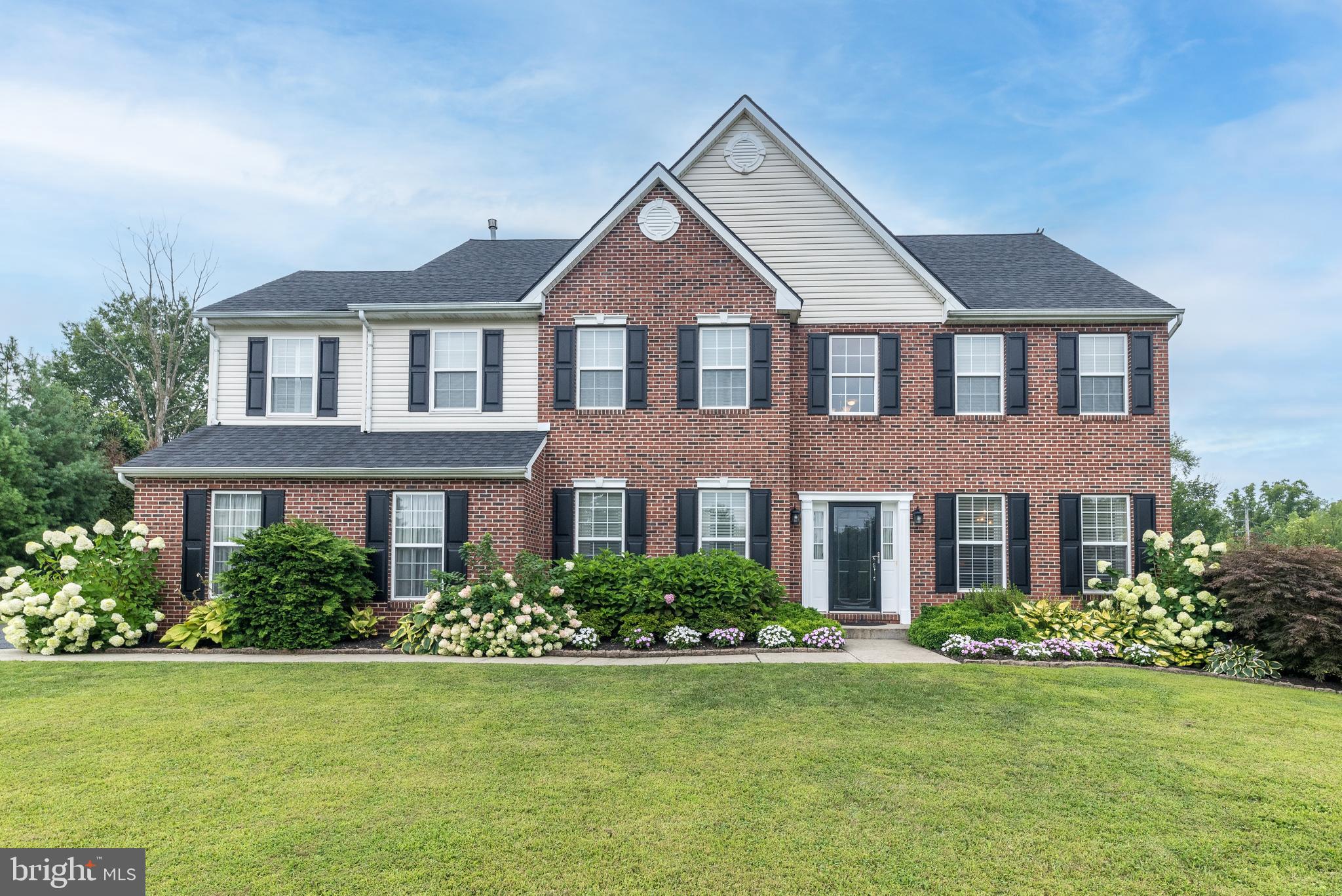 Your search is over! This well maintained stately brick colonial on beautifully landscaped grounds offers a finished basement and inground pool and is situated in a cul-de-sac. As you enter this magnificent home, the grand 2-story foyer stands out with its turned staircase. Elegant wainscotting, chairrails and crown molding in several rooms. Hardwood floors grace the foyer, living room, dining room, study, family room and powder room. Study with glass french doors is ideal for an in-home office, reading room or exercise room. Greet guests and entertain in style in the formal living room adjoining the formal dining room creating an open airy space. The dazzling and well-appointed kitchen is a balance of beauty, comfort & convenience featuring an abundance of cabinets, granite countertops, tiled backsplash, double oven, stainless steel appliances, pantry closet and center island for eating or a gathering place for guests. Breakfast area has skylights, doors to the patio and inground pool. The heart of the home is the spacious and bright two-story family room with skylights, gas fireplace and rear staircase. Convenient first floor laundry room. Powder Room with vanity sink. Primary bedroom suite that exudes elegance is enhanced with a tray ceiling, sitting room and walk-in closet. The primary bathroom defines luxury with sunken tub, separate tiled shower and double vanities. Three ample sized bedrooms and hall bathroom complete the second floor. Linen closets in hall bath and hallway. Walk-up floored attic for storage could be finished adding 600+ SF of living space. Finished basement has a wet bar, powder room, built-in cabinet, open area with carpeting, separate area with laminate flooring, egress window and storage room with refrigerator. Retreat to the fabulous patio with inground pool where you will spend countless hours enjoying the tranquil and picturesque yard with plenty of room for all your outdoor activities. Put this one on your list to see!