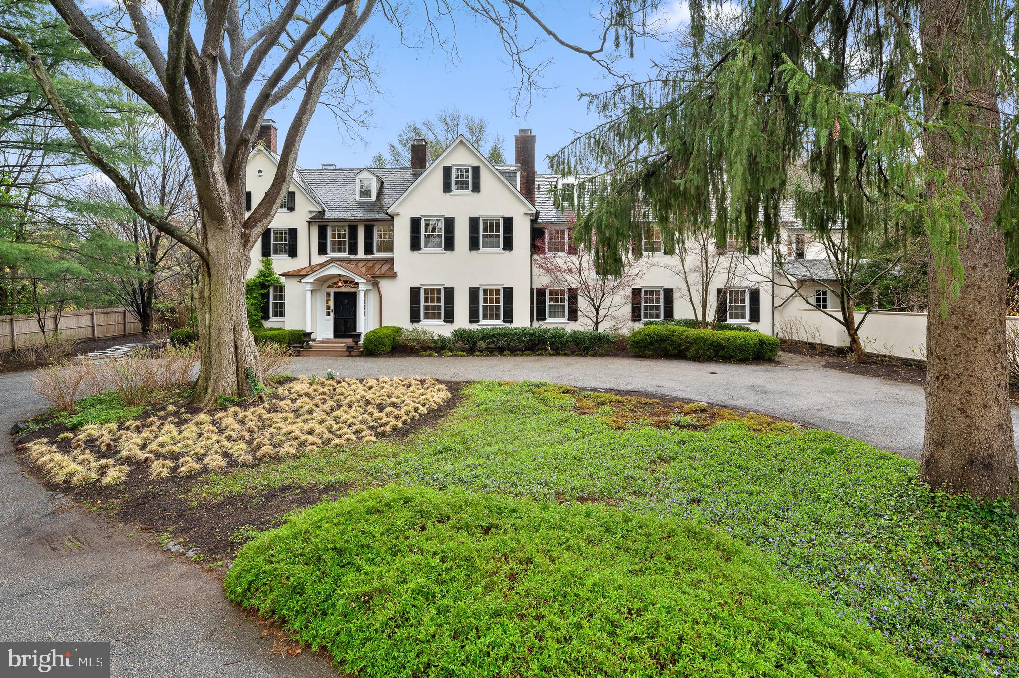 Elegance and Meticulous Craftsmanship of Yesteryear define this Truly Beautiful Property. This cherished home, with original build dating back to 1850, is one of the finest examples of gracious design with bygone era quality. As you enter this spacious property offering a circular drive, specimen plantings, mature shade trees, stunning views and gardens, you are captured by the Grandeur. Upon entering this inviting home, you are greeted by a truly special Entrance Foyer with Fireplace, incredible Original Millwork and Soaring Staircase with Landing overlooking beautiful Terrace and Gardens. The First level provides comfortable living with open areas yet exquisite charm through thoughtful architecture. A formal Living Room with Original Fireplace, French Doors to the terrace and full corner exposure-simply lovely; the Formal Dining Room complements the Living Room with a traditional “walk-through Foyer” for full enjoyment of this home; a warm and welcoming Library to the right of the Foyer with Fireplace and Formal Powder Room tucked away for guests-just perfect; the Traditional Hallway with arched Doorway leads to the Heart of the Home with Welcoming Kitchen, Living Area, Informal Powder Room, Gorgeous Sun-drenched Breakfast Area with corner exposure providing breathtaking views of Manicured Gardens and Perfectly
sized Pool for delightful Summer Enjoyment along with Level Play Field! The Second Level features a full Primary Suite running front to back with maximum Sunlight and Cross Breeze; the Primary Suite also features Custom Cabinetry Walk-in Closet and Completely Renovated Full Bath-not to be missed; an
Expansive Hall provides entrée to Four Additional Bedrooms-Two Ensuite with Newly Renovated Full Baths, Two sharing a Fully Renovated Hall Bath, a Study Space perfect for quiet time, and the Most
Important- a Full Laundry and Walk-in Original Linen Press. The Third Level offers four additional Bedrooms, Office, and Full Bath- the Perfect Suite for Guests. The thoughtfully designed Exterior of this Property provides the very best in year-round Entertaining with Gorgeous Pool, Terraces, Stepping Stone Pathway, Vegetable Garden, Seasonal Storage Structure and more. The Original Carriage House is an
Architectural Dream from another time- Not to be Missed! Convenient to all Shopping, Dining, Lower Merion Schools – this is the one you have been waiting to see!
NB The Carriage House and a small part of the Main House were built in 1850 with the majority of the house was built in 1930/31. We have the original plans available for review .
