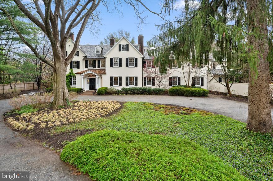 Elegance and Meticulous Craftsmanship of Yesteryear define this Truly Beautiful Property. This cherished home, with original build dating back to 1850, is one of the finest examples of gracious design with bygone era quality.  As you enter this spacious property offering a circular drive, specimen plantings, mature shade trees, stunning views and gardens, you are captured by the Grandeur. Upon entering this inviting home, you are greeted by a truly special Entrance Foyer with Fireplace, incredible Original Millwork and Soaring Staircase with Landing overlooking beautiful Terrace and Gardens. The First level provides comfortable living with open areas yet exquisite charm through thoughtful architecture. A formal Living Room with Original Fireplace, French Doors to the terrace and full corner exposure-simply lovely; the Formal Dining Room complements the Living Room with a traditional “walk-through Foyer” for full enjoyment of this home; a warm and welcoming Library to the right of the Foyer with Fireplace and Formal Powder Room tucked away for guests-just perfect; the Traditional Hallway with arched Doorway leads to the Heart of the Home with Welcoming Kitchen, Living Area, Informal Powder Room, Gorgeous Sun-drenched Breakfast Area with corner exposure providing breathtaking views of Manicured Gardens and Perfectly
sized Pool for delightful Summer Enjoyment along with Level Play Field! The Second Level features a full Primary Suite running front to back with maximum Sunlight and Cross Breeze; the Primary Suite also features Custom Cabinetry Walk-in Closet and Completely Renovated Full Bath-not to be missed; an 
 Expansive Hall provides entrée to Four Additional Bedrooms-Two Ensuite with Newly Renovated Full Baths, Two sharing a Fully Renovated Hall Bath, a Study Space perfect for quiet time, and the Most
Important- a Full Laundry and Walk-in Original Linen Press. The Third Level offers four additional Bedrooms, Office, and Full Bath- the Perfect Suite for Guests. The thoughtfully designed Exterior of this Property provides the very best in year-round Entertaining with Gorgeous Pool, Terraces, Stepping Stone Pathway, Vegetable Garden, Seasonal Storage Structure and more. The Original Carriage House is an
Architectural Dream from another time- Not to be Missed! Convenient to all Shopping, Dining, Lower Merion Schools – this is the one you have been waiting to see!
NB  The Carriage House and a small part of the Main House were built in 1850 with the majority of the house  was built in 1930/31.  We have the original plans available for review .