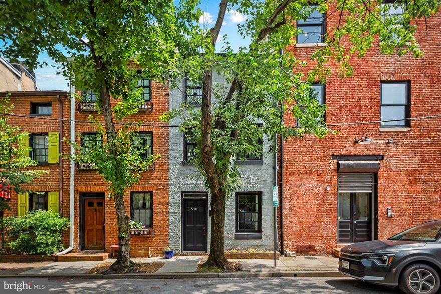 If these walls could talk! Welcome to 901 Tyson St.This quiet, leafy block of 1850’s townhouses is located in the heart of Mount Vernon. Known for its quirky Beatnik residents, speakeasies, and artists. Fantastic location conveniently located near Penn Station to get the MARC Train to DC, Amtrak to Philly and NYC, Light Rail, and Hopkins Shuttles to Homewood and Medical Campuses. University of Baltimore, MICA, and Peabody are virtually at your doorstep. Many well known cafes and restaurants are just around the corner. This is the most adorable home, renovated and updated but still retains all of its historic charm. The main level has a living room which has exposed brick above the cozy fireplace mantel, wide plank wood floors, and a dining area with exposed beams into the modern kitchen. The kitchen has stylish open shelving, a built in pantry, an oversized farmhouse style sink and butcher block counters and heated tile floors. The second floor has a primary bedroom with exposed brick, built in shelving and lots of natural light. The bathroom on this level has a large walk in shower with unique wood accents. There is also a small extra room which is perfect for a home office or exercise area. The third floor has an open loft space which is used as a bedroom along with a full bath. Off this floor is a private balcony perfect for a cafe table and chairs to enjoy coffee or wine. The current owner has used the home as an AirBnB with 80-90% occupancy with $4k in income per month. Discerning buyers will see this is a perfect investment for your home or financial future. Subject to the Midtown Special Benefits District Surcharge Tax.