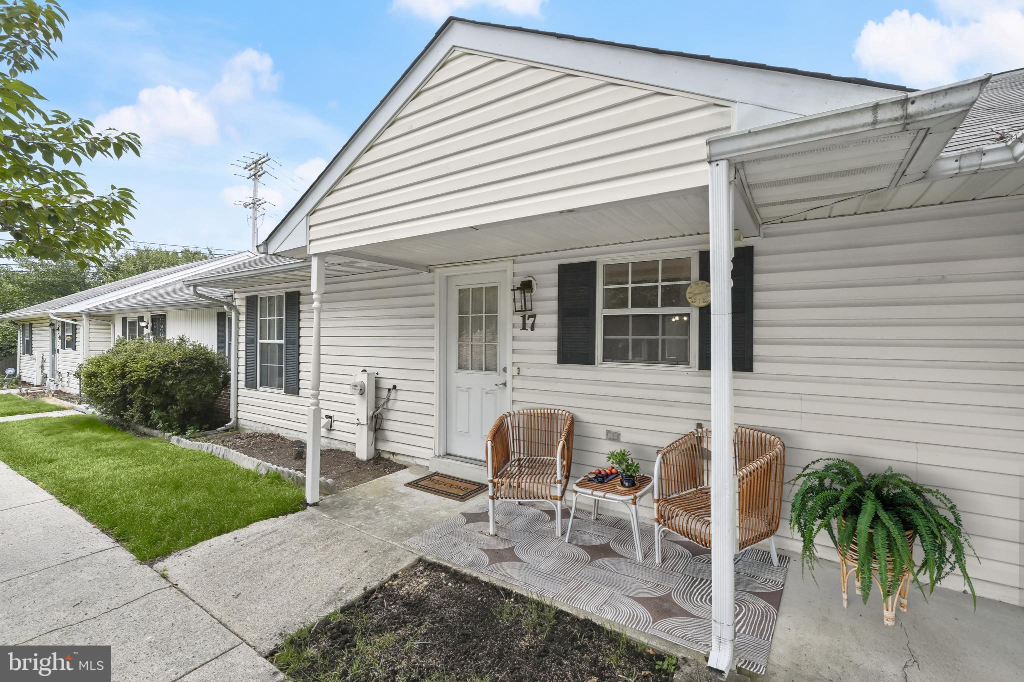 Enjoy low-maintenance, one-level living in this charming 55+ condo townhome designed for comfort and ease. A covered front porch welcomes you home and with no steps to navigate on the interior, the tone is set for relaxed accessibility throughout. Inside, fresh neutral paint provides a serene backdrop, paired with new carpet and laminate plank flooring in the kitchen and bathroom for a clean, updated feel. The open-concept layout seamlessly connects the living room, dining area, and kitchen, making daily life and entertaining effortless. A rare highlight of this unit is the spacious sunroom, not found in every unit of the community, offering abundant natural light and a sliding glass door that opens to the peaceful rear of the property. This flexible space also includes a walk-in closet, ideal for additional storage. The primary bedroom features two closets, and the full bath has been refreshed with a new vanity and features a standing shower for both style and functionality. A separate laundry room with built-in cabinetry keeps everything organized, and houses the home’s utility systems conveniently out of sight. Residents enjoy ample parking, making it easy for both owners and guests to come and go without hassle. Enjoy a lifestyle centered on ease and community with access to a vibrant community center offering activities and events, plus proximity to numerous parks, recreation areas, dining, shopping, and the local library. For commuters or day-trippers, this location is ideally situated near Laurel’s MARC train station, with quick access to I-95, MD-295, and MD-198, making travel to Baltimore, Washington D.C., and beyond a breeze. Everything you need, all on one level inside a warm, welcoming community that is FHA approved. Please note: all photos depicting furniture have utilized virtual staging.