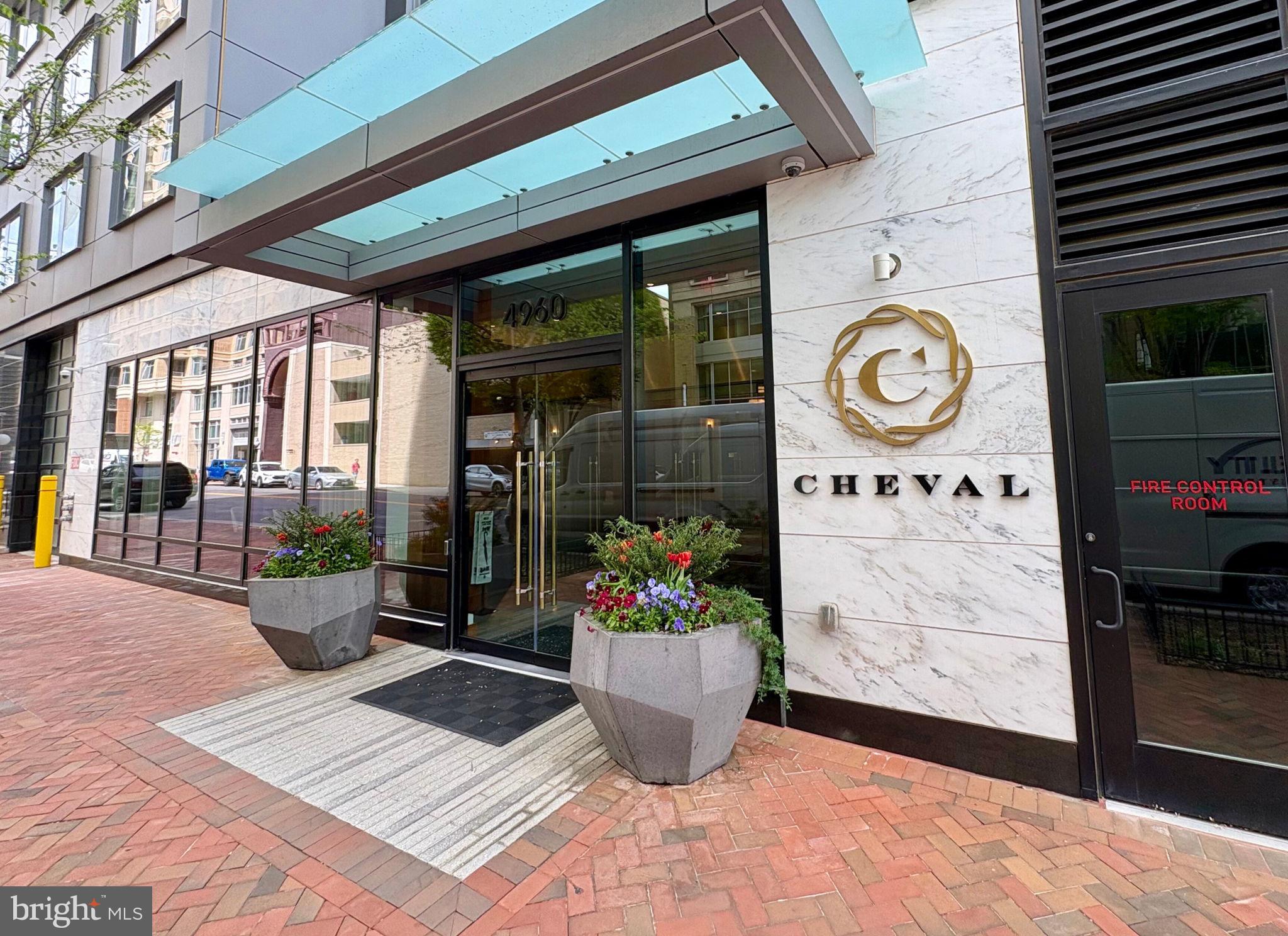 Come see Residence 706 at The Cheval, a luxury condominium offering modern elegance and effortless living in the heart of downtown Bethesda. Featuring floor-to-ceiling windows, upscale finishes, and an open-concept layout ideal for both everyday living and entertaining.
The sleek kitchen is outfitted with high-end appliances, quartz countertops, and custom cabinetry, opening to a spacious living area with sweeping views. The serene primary suite includes a spa-like en-suite bath and generous closet space. The versatile second bedroom is perfect for work and guests with a custom $14k Murphy bed which leaves the desk space in tact while it folds open to the bed. It’s super cool and easy to open!
Included with the unit is a separately deeded garage parking space (P3-12) close to the elevator equipee with an EV charger, a private storage unit (S-11), and two designated bike storage spots.
The Cheval residents enjoy top-tier amenities including a 24-hour concierge, fitness center, party room, and a rooftop deck with grills, bar seating, and panoramic city views. The monthly condo fee covers building maintenance, management, insurance, water, sewer, trash, and more. Must see!
