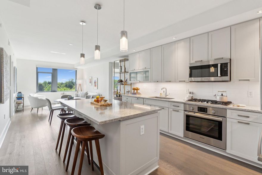 Luxury living in the heart of downtown Bethesda! Residence 706 at The Cheval offers floor-to-ceiling windows, upscale finishes, and an open layout just 2 blocks to Metro. The sleek kitchen features high-end appliances, quartz countertops, and custom cabinetry, opening to a spacious living area with sweeping views. The serene primary suite includes a spa-like bath and generous closet space. A versatile second bedroom doubles as an office or guest space, complete with a custom Murphy bed that keeps the desk in place when open. Boutique building with concierge, fitness center, rooftop lounge, and secure garage parking.

Included with the unit is a separately deeded garage parking space (P3-12) close to the elevator equipped with an EV charger, a private storage unit (S-11), and two designated bike storage spots.
The Cheval residents enjoy top-tier amenities including a 24-hour concierge, fitness center, party room, and a rooftop deck with grills, bar seating, and panoramic city views. The monthly condo fee covers building maintenance, management, insurance, water, sewer, trash, and more. Must see!