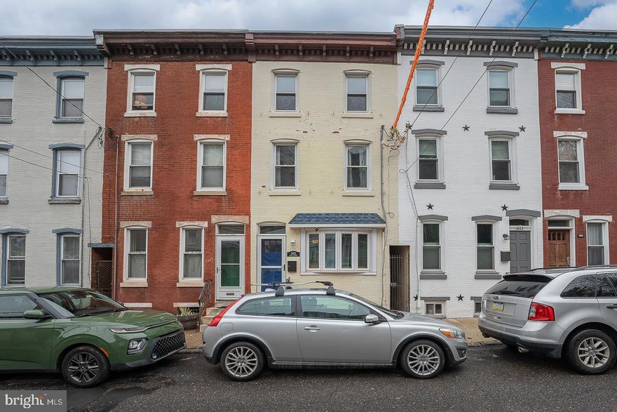 Very impressive, renovated 3-story, 3 bedroom/2 bath home nestled on a charming, sought-after block in the heart of the Art Museum Area! Step into the light-filled, inviting living room showcasing decorative crown molding, an exposed brick wall and gleaming hardwood floors. There is a separate dining area, an ideal space for family & friends to gather. The fantastic kitchen, which offers stylish white cabinetry, beautiful granite counter tops, subway tile backsplash & newer SS appliances, opens to a lovely private patio. A sleek metal staircase leads to the second floor which houses a large, sunny front bedroom with built-in bookshelves, a good-sized middle bedroom with a rolling barn door, and a delightfully renovated full bathroom with washer/dryer. The third level boasts the master suite floor with beautiful bathroom. The basement is ideal for plenty of storage. Central air. Ideally located to all of the amazing attractions of the Art Museum Area. Move right in!