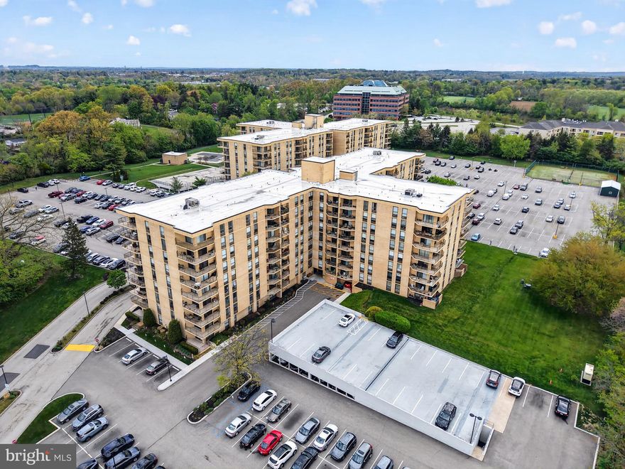 Welcome to this sunny Corner Unit in sought-after Plymouth Hill!  This 2 bedroom, 2 bath residence has a bright & open floor plan, with a wraparound balcony that gives fantastic views of the sunrise, sunset, and the peaceful surrounding green space.  Upgrade your lifestyle and live in a vibrant community with amenities galore:  24 hour security, heated pool, 2 fitness centers, a card room/library, tennis/basketball courts, and a fantastic walking path.  Step inside to find a spacious living room (22 X 19), with two sliding glass doors that allow tons of natural sunlight to pour into the space.  You'll notice the attractive flooring all throughout the main living space.  The kitchen boasts a great open layout, with a breakfast bar that faces the windows for beautiful views while you eat breakfast or entertain friends.  Light wood cabinetry, granite countertops, and a neutral tumbled tile backsplash add to the appeal of the kitchen.  There is also a dedicated dining area, and plenty of space to add an office or hobby area.  The main bedroom (23 X 11) features a walk-in closet, and an en-suite bathroom.  Bedroom two also offers ample closet space, and there is another full hall bathroom.  This unit has a space-saving stackable washer/dryer for added convenience! This is a pet-friendly community, so your furry friends are welcome.  The reasonable monthly condo fee has REAL value, and conveniently covers ALL utilities & amenities (Electric, Heat & A/C, water, sewer, trash, cable, exterior building maintenance, common area upkeep, pool, fitness centers, recreation facilities, tennis/basketball courts, lawn maintenance, snow removal, and 24-hour security!)   Enjoy resort-style living in a super convenient location - walkable to the Plymouth Meeting Mall (Dining, shopping, and entertainment), and adjacent to the major highways for quick and easy travel.  It's time to indulge in low-maintenance, high-quality living at Plymouth Hill, so schedule your appointment today beore this corner unit is gone!