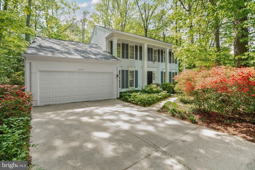 This beautifully maintained 4-bedroom, 3-level colonial is nestled in the heart of highly desirable Burke Centre on an incredibly rare .57-acre level wooded lot—offering privacy and space that’s nearly impossible to find in the community.
A stately front porch with two-story columns welcomes you into a spacious foyer and a main level featuring hardwood floors throughout. The oversized living room includes custom built-ins, while the formal dining room impresses with a modern chandelier, built-in corner cabinets, and a glass-paned door. The family room centers around a raised brick hearth fireplace—currently electric, but plumbed for gas and convertible back to wood-burning. A sliding glass door leads to the patio for seamless indoor-outdoor entertaining.
The updated kitchen features white cabinetry, granite counters, stainless steel appliances (including Bosch dishwasher and a 2024 smart oven), and a skylight that floods the space with natural light. The adjoining breakfast room offers a bay window overlooking the lush yard and French doors to a screened porch, creating a perfect flow for gatherings. The backyard is a true retreat—lined with trees, azaleas, and plantings, and enhanced by brick paths winding through the private wooded setting.
Upstairs, the oversized primary suite includes a dressing area, walk-in closet, and built-in shelving. The en suite bath was beautifully remodeled in 2020 with subway tile, oiled bronze fixtures, and a sleek glass shower. Three additional bedrooms and another full bath complete the upper level, with new carpet (2025) throughout.
Notable updates include a new roof (2018), high-efficiency Carrier gas HVAC with UV light and Aprilaire humidifier (2017), gas water heater (2017), renovated half bath (2017), new garage door (2023), opener motor (2025), and updated lighting. The kitchen is also plumbed for a gas stove, giving flexibility for future upgrades.
Located in the Robinson school pyramid (Fairview Elementary), this home offers access to Burke Centre’s pools, tennis courts, 30+ miles of trails, ponds, a lake, and the VRE. A rare combination of space, privacy, and community living—this home is a must-see.