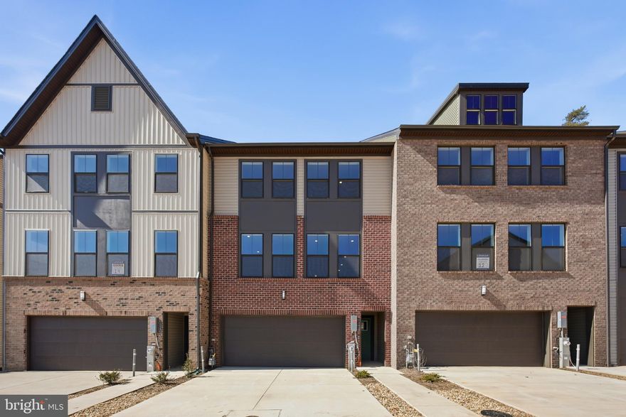 Immediate Delivery! This new luxury townhome offers 3 bedrooms, 2 full baths, 2 half baths, and a 2-car garage with 2,660 square feet of thoughtfully designed living space. A private elevator provides convenient access to every level.

The upgraded gourmet kitchen features quartz countertops, stainless steel appliances, double wall ovens, a 36” five-burner gas cooktop with a custom range hood, and a spacious center island perfect for entertaining. The oversized owner’s suite includes a tray ceiling, a large walk-in closet, and a luxurious owner’s bath with a super shower. Enjoy peaceful wooded views and added privacy as the home backs to forest conservation.