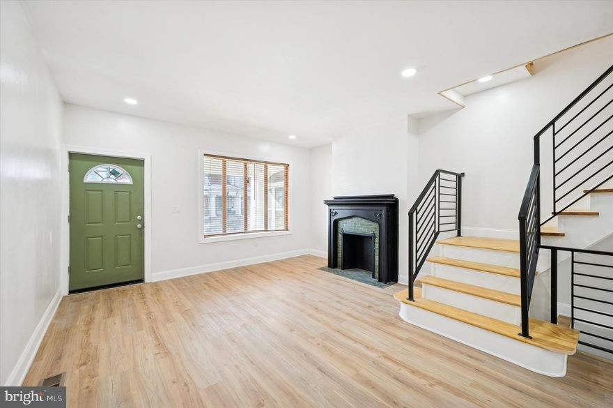 Welcome to 5831 Washington Avenue, ideally situated in the Cobbs Creek section of Philadelphia. This beautifully renovated residence is set along a picturesque, tree-lined block and offers exceptional access to University City and Center City Philadelphia, making it a convenient location for work, dining, and entertainment. The home is also located near Cobbs Creek Park and just minutes from the shops and local eateries along Baltimore Avenue. As you approach the property, you are welcomed by a classic concrete front porch—an inviting space for outdoor lounging and everyday relaxation. Inside, the home features a thoughtfully designed interior with durable flooring, high ceilings, recessed lighting, and a seamless open-concept layout that flows effortlessly into the newly renovated kitchen. The kitchen is appointed with soft-close cabinetry and an elegant gold-and-white accented backsplash, creating a refined and modern aesthetic. Direct access from the kitchen leads to the rear outdoor space, where a newly constructed deck extends the living area and provides additional space for entertaining or relaxation. The fully finished walk-out basement adds exceptional versatility, featuring a newly updated full bathroom and porcelain tile flooring well-suited for the space. Recessed lighting enhances the bright, polished feel, while the layout allows for a family room, media area, or entertaining space. A separate rear room offers flexibility for a home office, fitness area, or additional private use. The laundry area is also conveniently located on this level.
The second floor continues the cohesive design with consistent vinyl flooring throughout and includes four spacious bedrooms, each featuring recessed lighting. The primary bedroom offers high ceilings, an exposed brick accent, generous closet space, and abundant natural light. A hall linen closet provides added storage, while the full hallway bathroom is well-sized and tastefully finished. The three additional bedrooms each offer unique character and flexibility to suit a variety of needs. This home presents a well-balanced blend of modern upgrades, functional design, and an accessible location—offering a turnkey opportunity in a well-established Philadelphia neighborhood.