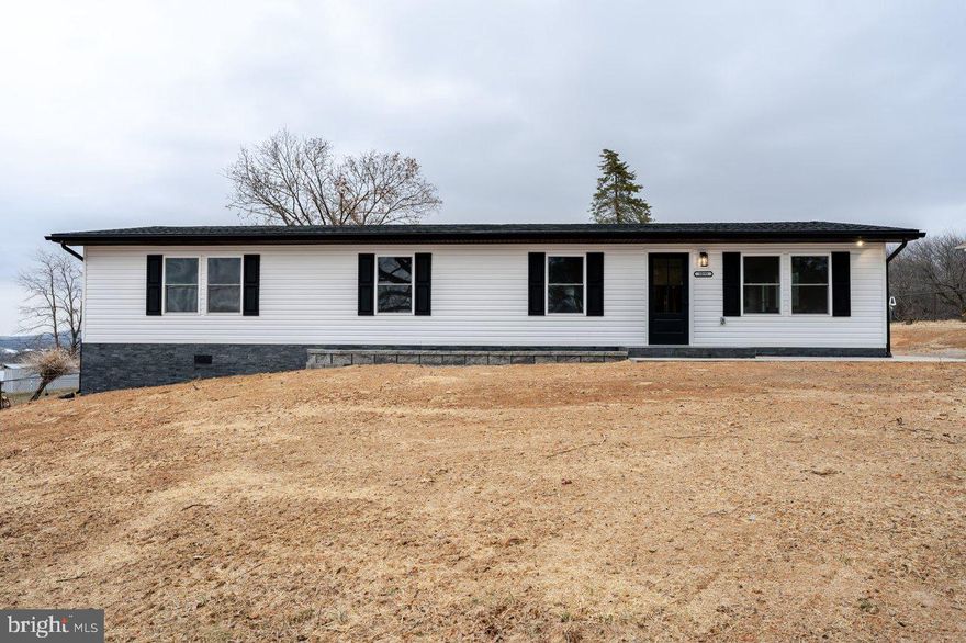 Welcome to your perfect new home! This beautifully renovated 3-bedroom, 2-bath home sits on a spacious ½-acre lot, offering a perfect blend of modern comfort and peaceful surroundings with stunning mountain views. Step inside to discover a bright and airy open-concept kitchen and living area, designed for both relaxation and entertaining. The brand-new kitchen boasts custom cabinets, elegant quartz countertops, stainless steel appliances, and sleek polished porcelain flooring. Luxury Vinyl plank flooring finishes the main living spaces throughout, for a clean and sophisticated look. The primary suite is your personal retreat, featuring a large walk-in closet and a luxurious custom walk-in shower in the primary bath. The fully finished basement, complete with inside and outside entry, adds endless possibilities—whether you’re envisioning a guest suite, home office, or recreation space. Every detail has been thoughtfully upgraded—everything is new, from top to bottom. Enjoy the comfort of a completely updated home that’s close to all of the surrounding town's conveniences, yet perfectly positioned to take in peaceful, scenic views.