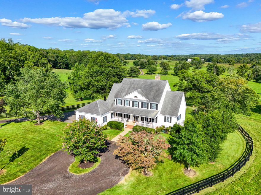 Own your piece of Virginia Horse and Wine Country living,  just a few short minutes away from energetic downtown Warrenton and thriving Northern Virginia. This property is offered for the first time to its new family! Located in  Castle Welch Farms, this has a total of 6 total lots and homes with idyllic serene landscapes that overlook the beautiful mountain side and pastoral views. This 51 acre parcel contains everything one could desire of the land. The Great Run tributary has 978 feet of frontage and accessible on the property. The colonial style farmhouse is enchanting with a full sized covered porch, perfect for watching sunsets with a cold beverage. Entry way foyer is traditionally flanked by a formal dining room to the left and office/den on the right. The views of the gorgeous countryside can be seen directly from the main entryway though the newer energy efficient windows. Family room has a two story ceiling with the bold focal point being the stone floor to ceiling fireplace. Built-in solid walnut wood book shelves make for a perfect storage solution for family games, artwork and keepsakes.  The kitchen has been recently updated to feature granite counter tops and island, newer cabinetry, and stainless appliances. Plenty of room for an eat in kitchen as the bright and sunny bump out is perfect for the whole family to gather. One of two laundry areas can be found on the main level as well as a large owners suite with large luxury owners bathroom. Access to the no maintenance deck can be access via the primary and the family room areas. Entertainers dream back yard space with flat prime space perfect for infinity edge pool that would look onto existing 2 acres stocked fishing pond and a peaceful landscape. Upper level offers hardwood flooring as well as 3 large bedrooms and a Jack and Jill Bathroom. Lots of storage space throughout! Fully finished basement has large entertaining space with bar,  fireplace, full bathroom, and flex space for bedroom or other use. Kitchenette area is fully functional in basement  along with the second washer and dryer spaces! French doors from walk out basement leads to large paver patio. Owned propane tank on site which fuels the whole house generator that will surely come into good use for those rare power outage events. The outbuildings on this property include multiple sheds, barns, and fenced in areas to keep the livestock corralled.  90 x 42 foot Morton metal building/barn can easily be converted to horse stables, includes an office, tack room and restroom. Shop space on site is 40 x 36 with two 16 x 11 garage doors this also has storage loft. Additional 40 x 16 lean to located on the back side of the shop. Very close to Fauquier Springs Country Club , wineries, breweries, and markets. You won't want to miss the opportunities this home provides! Schedule your tours today!