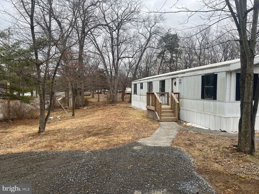 1.22 Acres with Move-In Ready Mobile Home & Approved 3BR Build – Utilities Installed!

Stop searching for land and start building! This is the ultimate "hook-up" property located on a quiet 1.22-acre lot, just minutes from downtown and shopping. Whether you want to move in immediately while you plan or start construction right away, this property has everything in place.

The Land & Utilities:

Approved & Ready: County-approved septic system capable of supporting a new 3-bedroom home.
Power Ready: Electric meter is already installed on a pole, waiting for you to connect your new home.
Water: Private well already installed and operational.
The Lot: Flat, cleared, and ready for foundation work.
The Structures & Bonus:

Existing Home: A single-wide mobile home is currently on the property, perfect for immediate occupancy, storage, or a rental unit during construction.
Plans Included: Approved architectural plans for a beautiful 3-bedroom home are included in the sale! Save thousands on architectural fees—just pull the permit and build. (Buyer to verify permit status with county).
Location:
Enjoy the peace and quiet of country living while being less than 5 minutes from downtown amenities, restaurants, and grocery stores.

This is a rare opportunity to own a piece of land that is truly "shovel-ready." Seller is motivated!