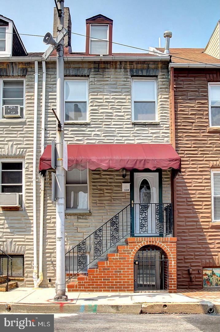 (MORE PHOTOS COMING SOON) GREAT OPPORTUNITY TO LIVE IN LITTLE ITALY AND INVEST IN YOUR FUTURE! This charming 3BR, 3BA townhouse offers the best of both worlds—affordable city living with income potential. Nestled in one of Baltimore’s most tight-knit and vibrant neighborhoods, this move-in ready home features newer carpet, a finished basement, and a private outdoor patio—perfect for relaxing or entertaining. Enjoy the unmatched walkability to Harbor East, the Inner Harbor, and Fells Point, with renowned dining, shopping, and entertainment just steps away. Embrace local traditions like evening bocce games and Friday night outdoor movies right in your community. The lower level has a private entrance and was recently rented as a 1BR/1BA unit for $500/month, making it an ideal income-producing space. The property is Baltimore City rental licensed and MDE lead paint registered, giving you peace of mind and flexibility as an owner-occupant or investor. Live upstairs and rent the lower level—or enjoy the whole space for yourself! This is your chance to own a versatile property in one of Baltimore’s most beloved neighborhoods.