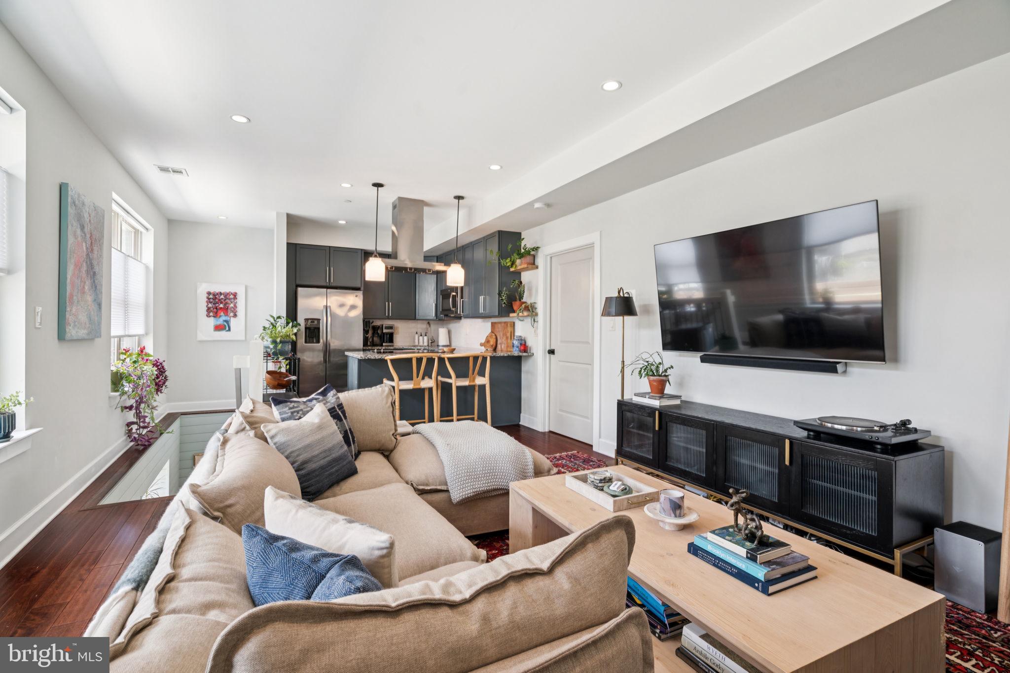 Your Pinterest board comes to life in this jewel box condo, nestled in the vibrant Francisville neighborhood of Philadelphia.
No detail has been overlooked in this impeccably renovated three-bedroom, two-bath home, where custom millwork, designer-selected fixtures and finishes have replaced every builder-grade touch. From the moment you enter through your private exterior-access front door, thoughtful design greets you at every turn.
The open-concept living and dining area is flooded with natural light from a full wall of east-facing windows, highlighting the warm birch hardwood floors. The adjacent kitchen features granite countertops, professionally painted cabinetry, and stainless steel appliances, creating a space that is both functional and stylish.
The main level also includes a serene primary suite, framed by another full wall of windows dressed with linen curtains and blackout blinds. A huge walk-in closet provides ample storage, while the spa-like en-suite bath offers a glass-enclosed shower and built-in storage solutions that balance beauty and utility. A custom upholstered valance pulls together the serene sea glass colored board and batten millwork for a cohesive, designer look.
Head down the shiplap-clad stairwell, complete with a chic jute stair runner, to a spacious lower level. This floor offers a large flex space—currently used as a home gym—a laundry room, a second full bathroom, and two additional bedrooms, each with generous windows for natural light and walk-in closets.
Smart-home living is made easy with a Nest system controlling the recently upgraded central air system and a Yale keypad lock on the front door—offering year-round comfort and keyless security.
Enjoy warm evenings on the expansive communal roof deck, recently updated with new flooring and offering breathtaking Center City skyline views—an ideal space for entertaining or unwinding.
The building’s striking facade combines cast stone, brick, tile, and vertical metal siding, bringing a distinctly modern edge to the neighborhood. Just one block from the Fairmount Avenue corridor, this home offers unbeatable walkability to beloved local spots like Bar Hygge and RyBread for dining, Stone’s for unique beer and locally made ice cream, and Aiyah boutique for shopping—all just a couple blocks away. You'll be right around the corner from Francisville playground, The Spring Gardens, Roberto Clemente Playground and the Green Street Dog Park. With easy access to public transit and nearby green spaces, the best of city living is right outside your door.
Buyers are responsible for verifying taxes and square footage.