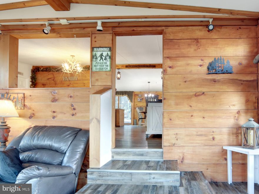 Located in Valley High Timber Farms with no HOA, this 11.02-acre wooded retreat offers total privacy, riding trails, a shooting range, and a wet weather stream, all just 10 minutes from public river access and near Sideling Hill WMA. The property features two distinct residences including a 3BR/2BA double-wide on a permanent foundation with a 5-year-old metal roof, multiple large decks, and a Guardian whole-house generator,  a new instant water heater, plus a separate 1BR/1.5BA single-wide with its own driveway and full kitchen. Both homes are serviced by a new water softener and a water purification system. Outdoor improvements include a massive 24x32 enclosed metal pole barn with electric built in 2020, a greenhouse, and a heavy-duty 10-gauge wire enclosure ideal for a secure garden, poultry, or specialized animal housing. This versatile property is the ultimate turnkey setup for recreation, hunting, or a private estate with separate living quarters. IMPORTANT! GPS to 516 Roberts ROAD, not Lane.